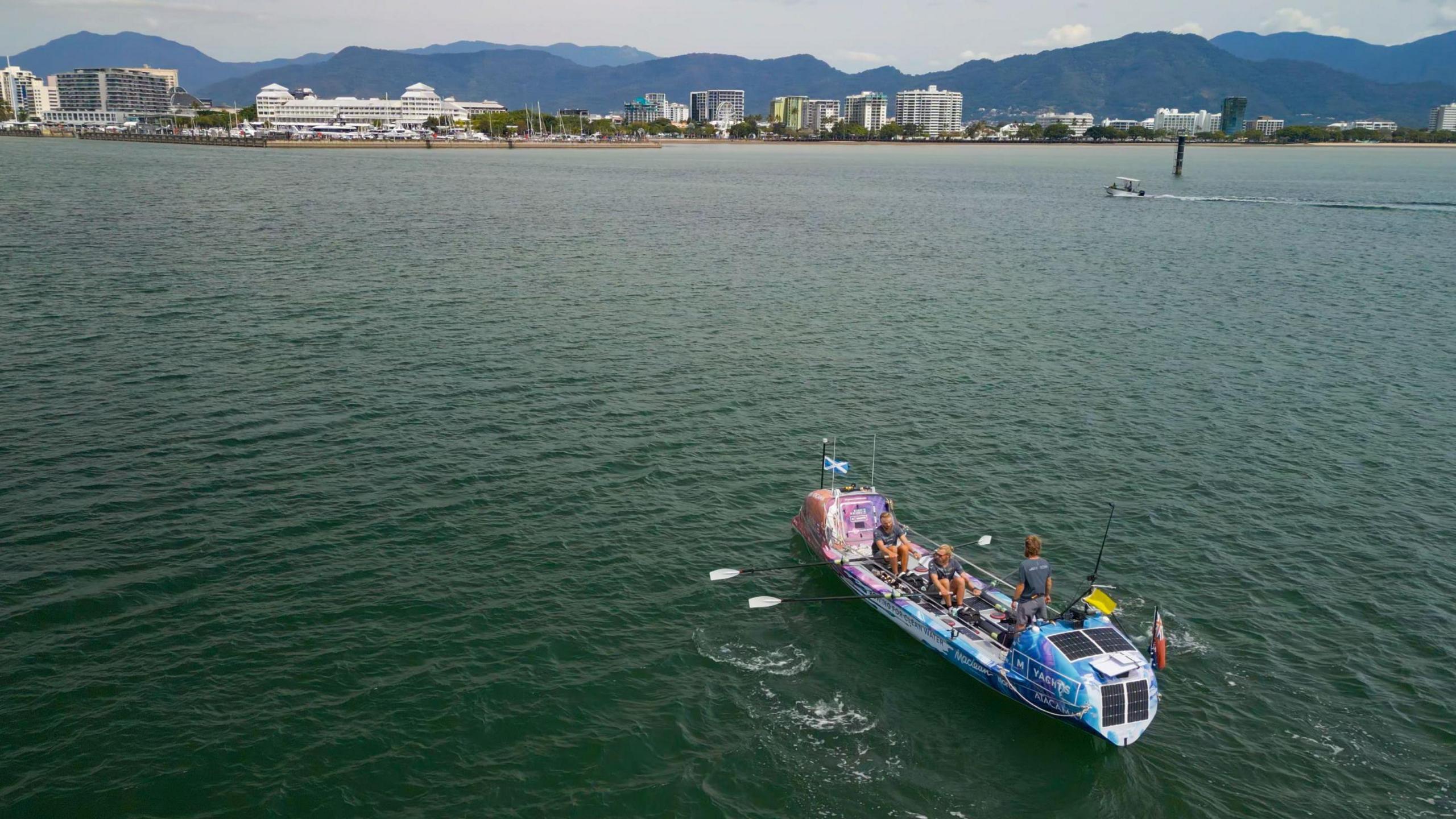 An aerial view of the MacLean brothers' rowing boat as they make their way into the harbour at Cairns in Australia.