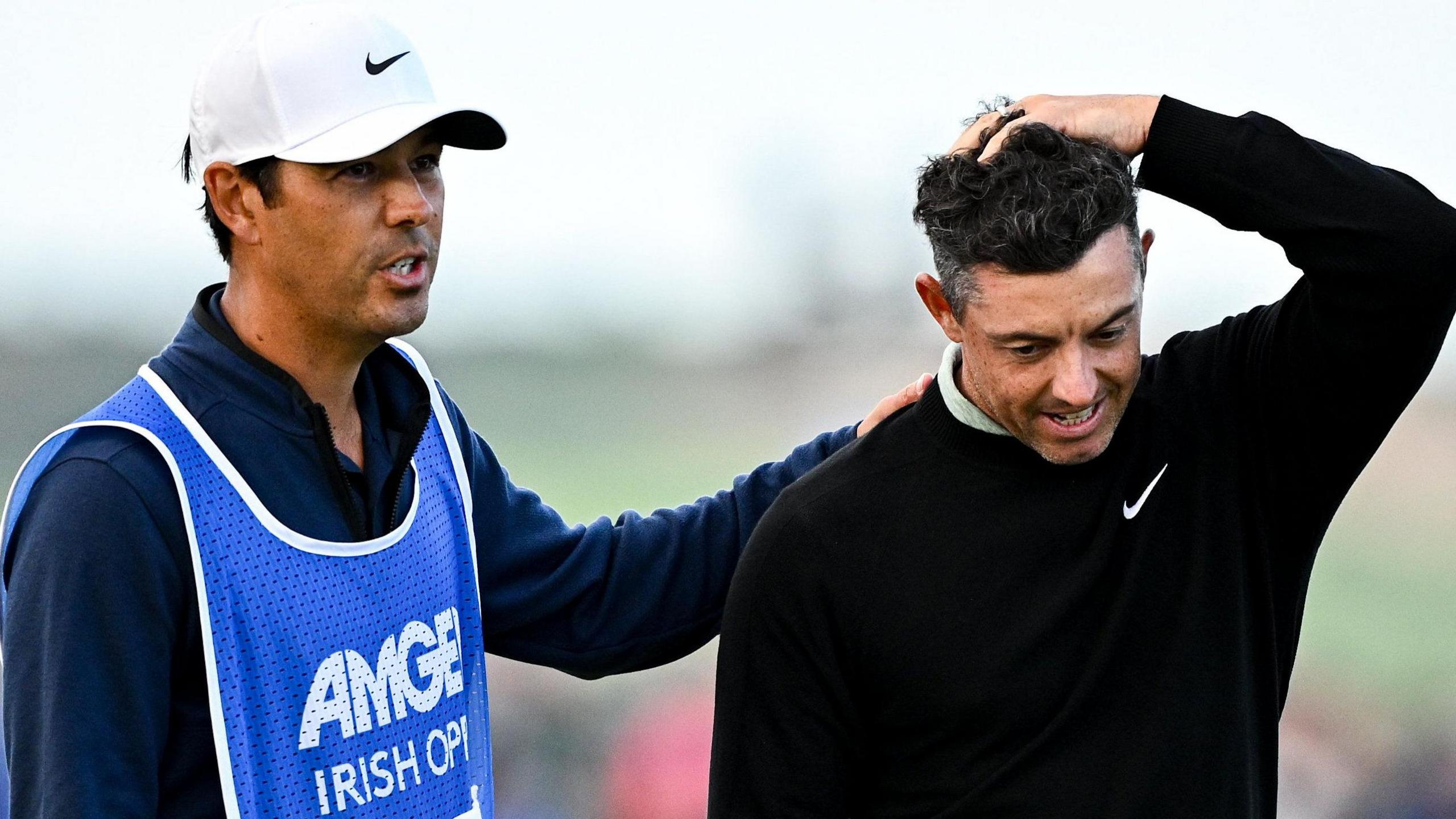 McIlroy is consoled by his caddie Harry Diamond