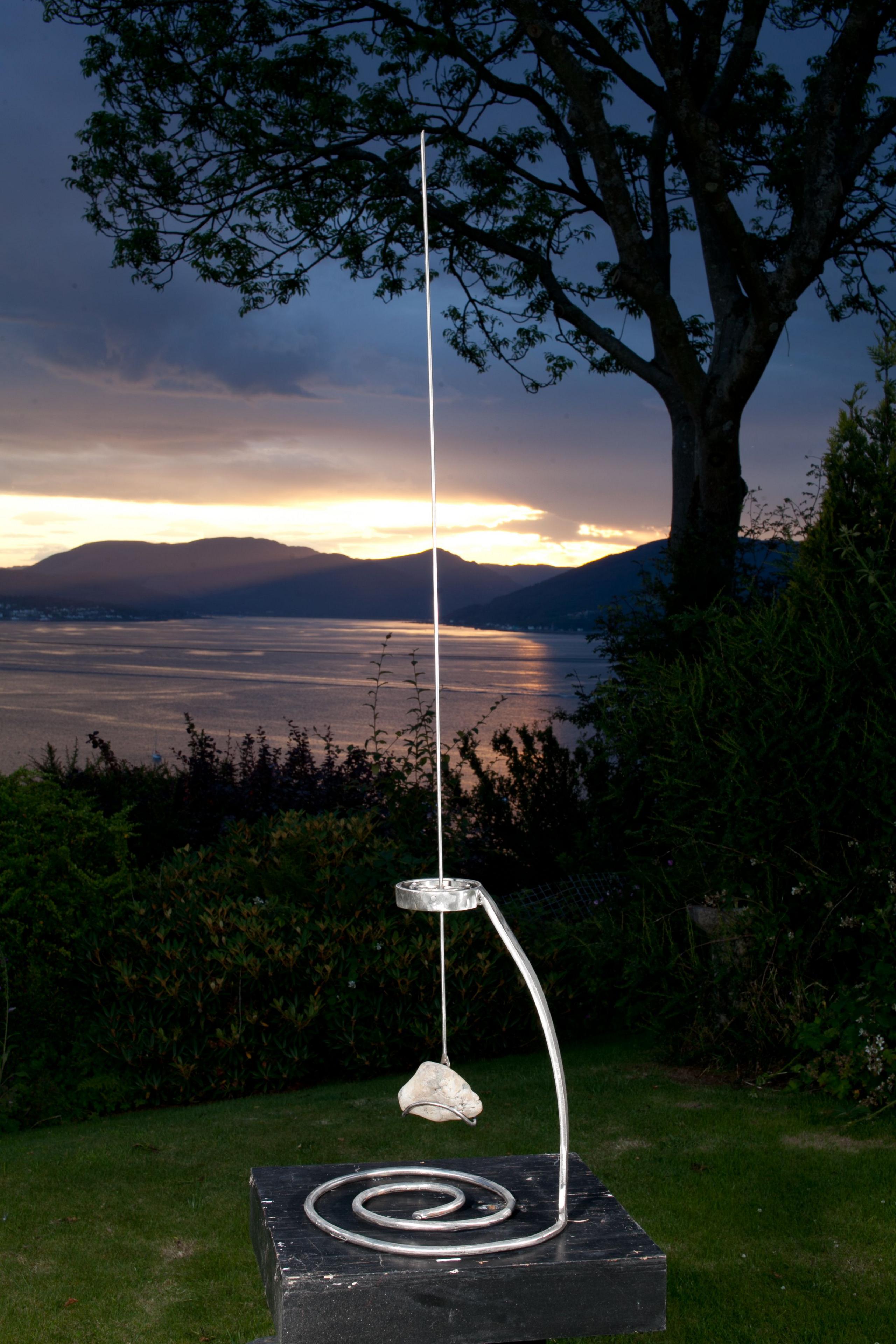 Spire sculpture with the River Clyde in background