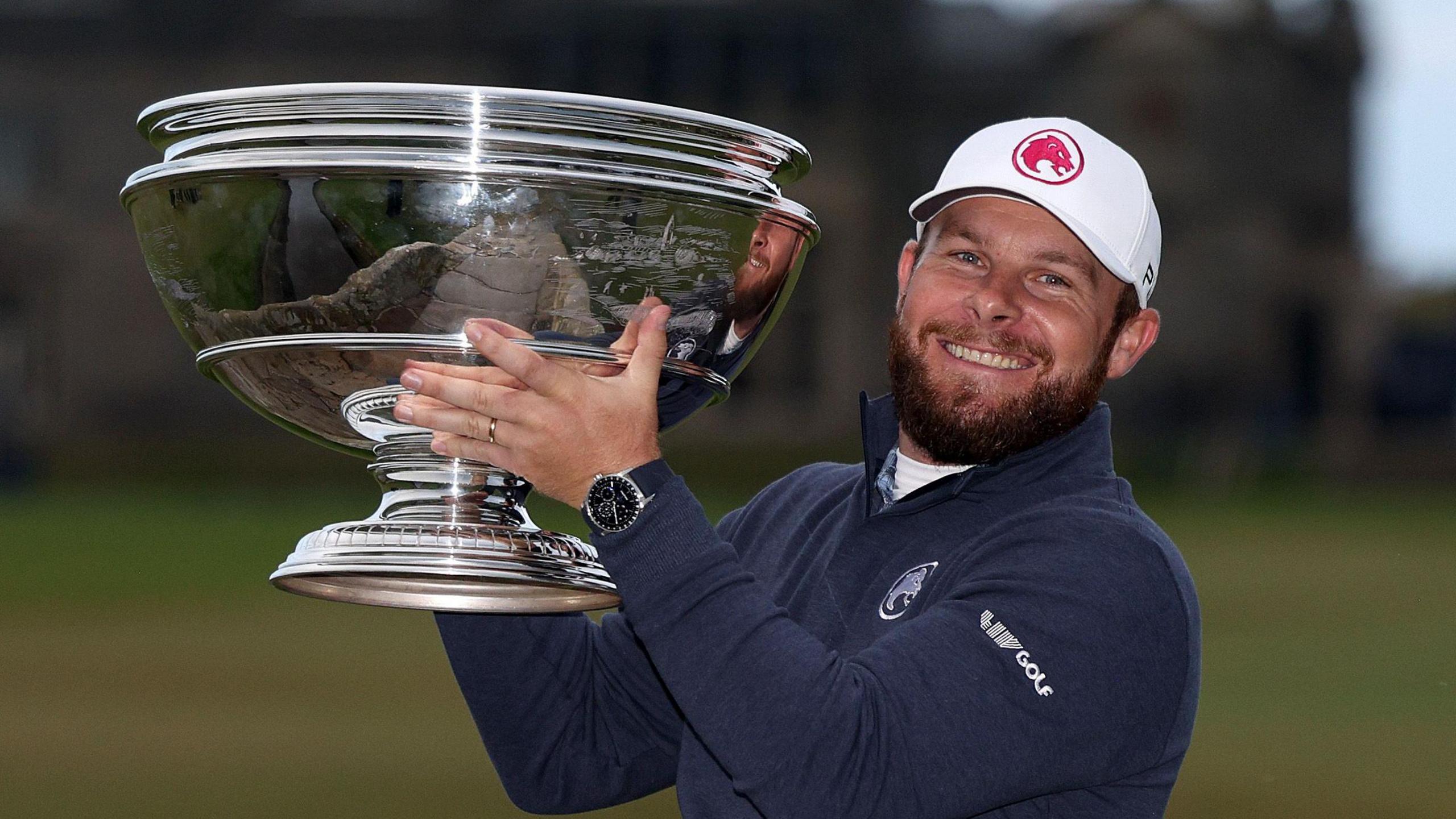 Tyrrell Hatton poses with the Alfred Dunhill Links Championship trophy