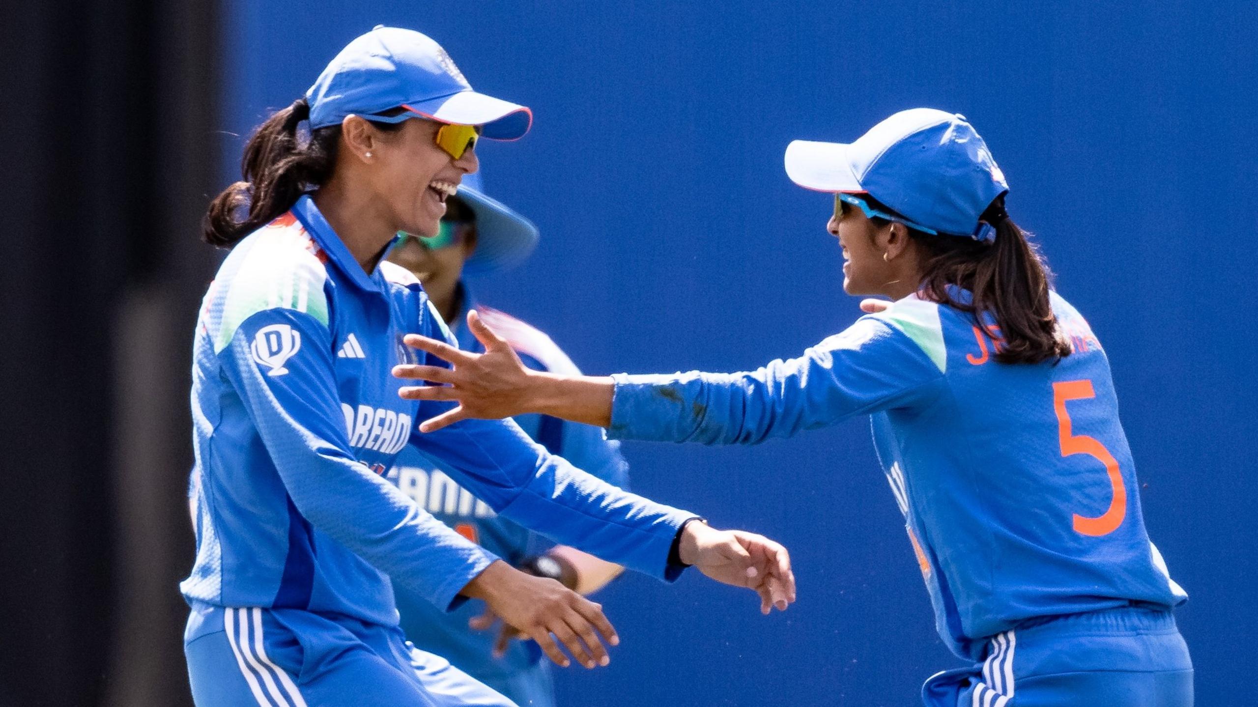 Jemimah Rodrigues of India (right) celebrates with team mates after taking a catch to dismiss Nat Sciver-Brunt of England during the 1st Women's ODI between England and India at Utilita Bowl 