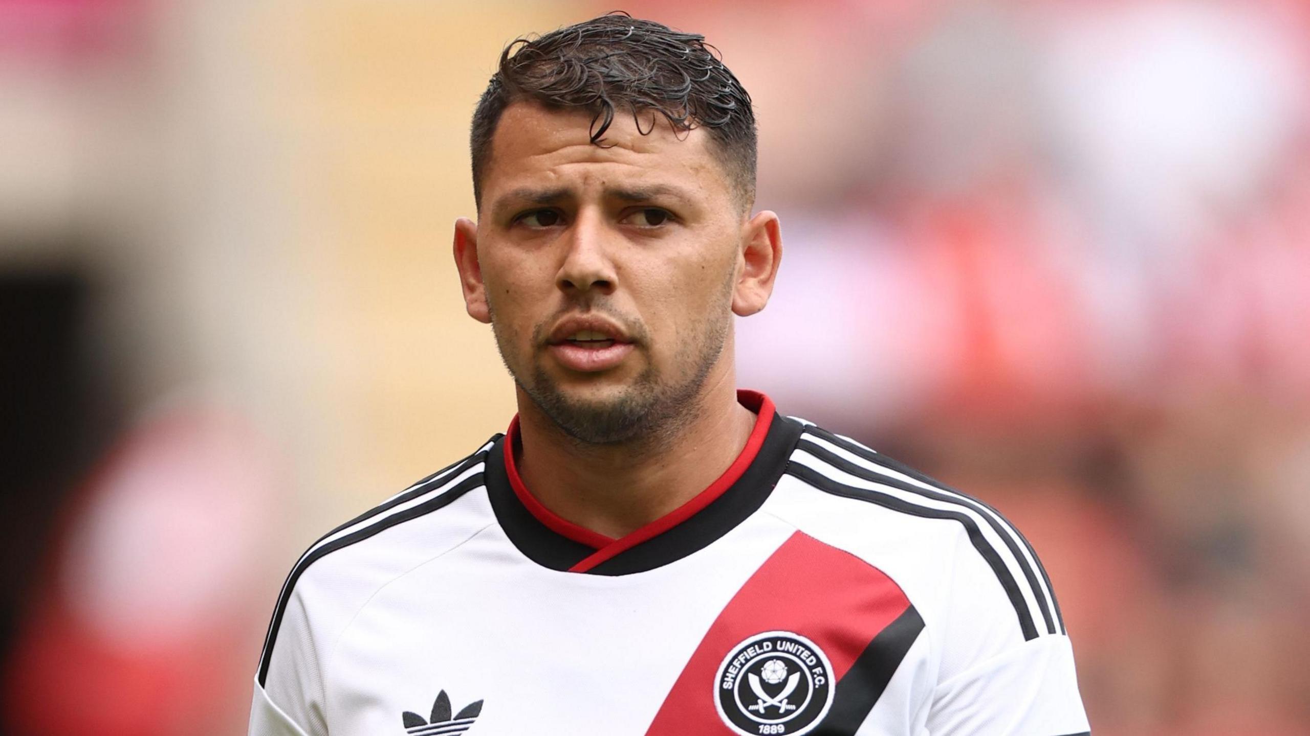 Gus Hamer playing at Rotherham in a pre-season friendly in Sheffield United's new away kit