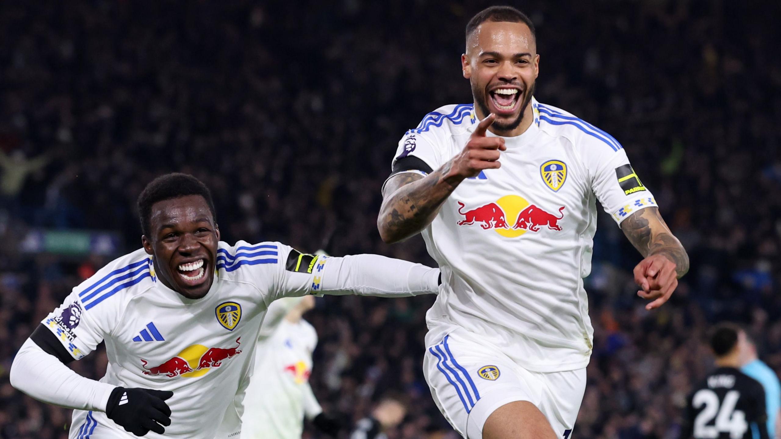 Lukas Nmecha of Leeds United celebrates scoring his team's first goal with teammates 