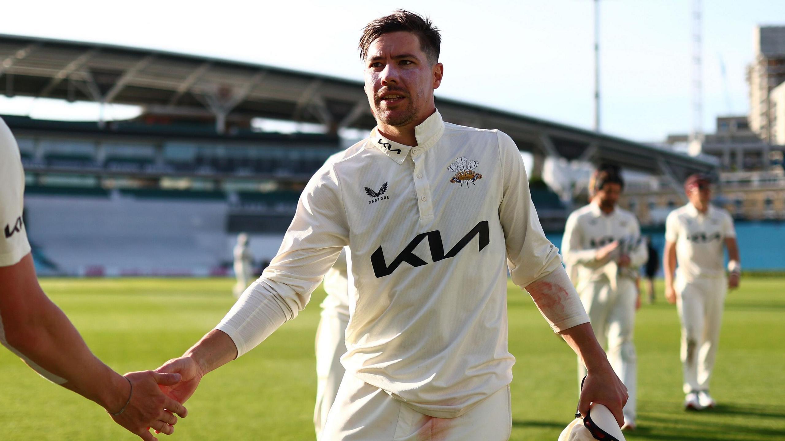 Surrey captain Rory Burns celebrates with Dan Worrall at The Oval