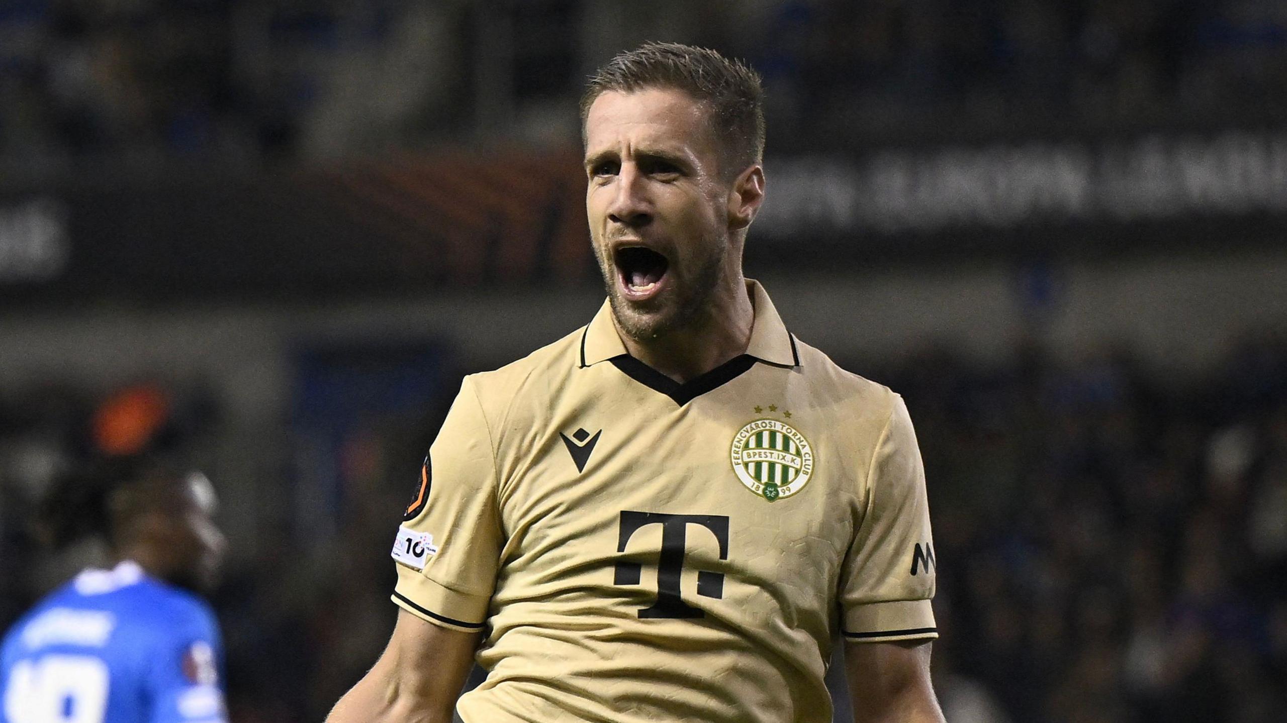Ferancvaros striker Barnabas Varga celebrates scoring against Genk