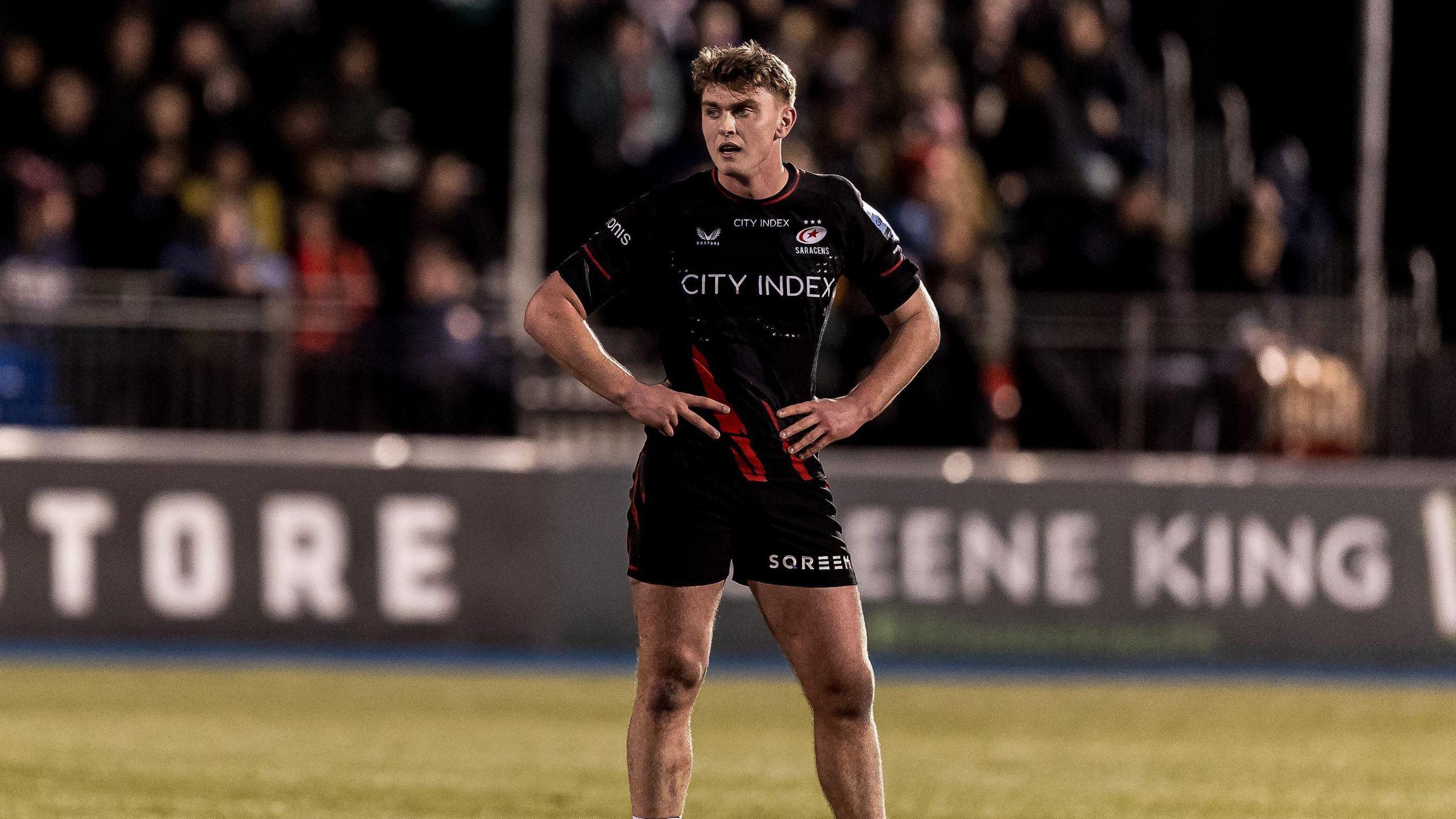 Olly Hartley standing on the pitch 