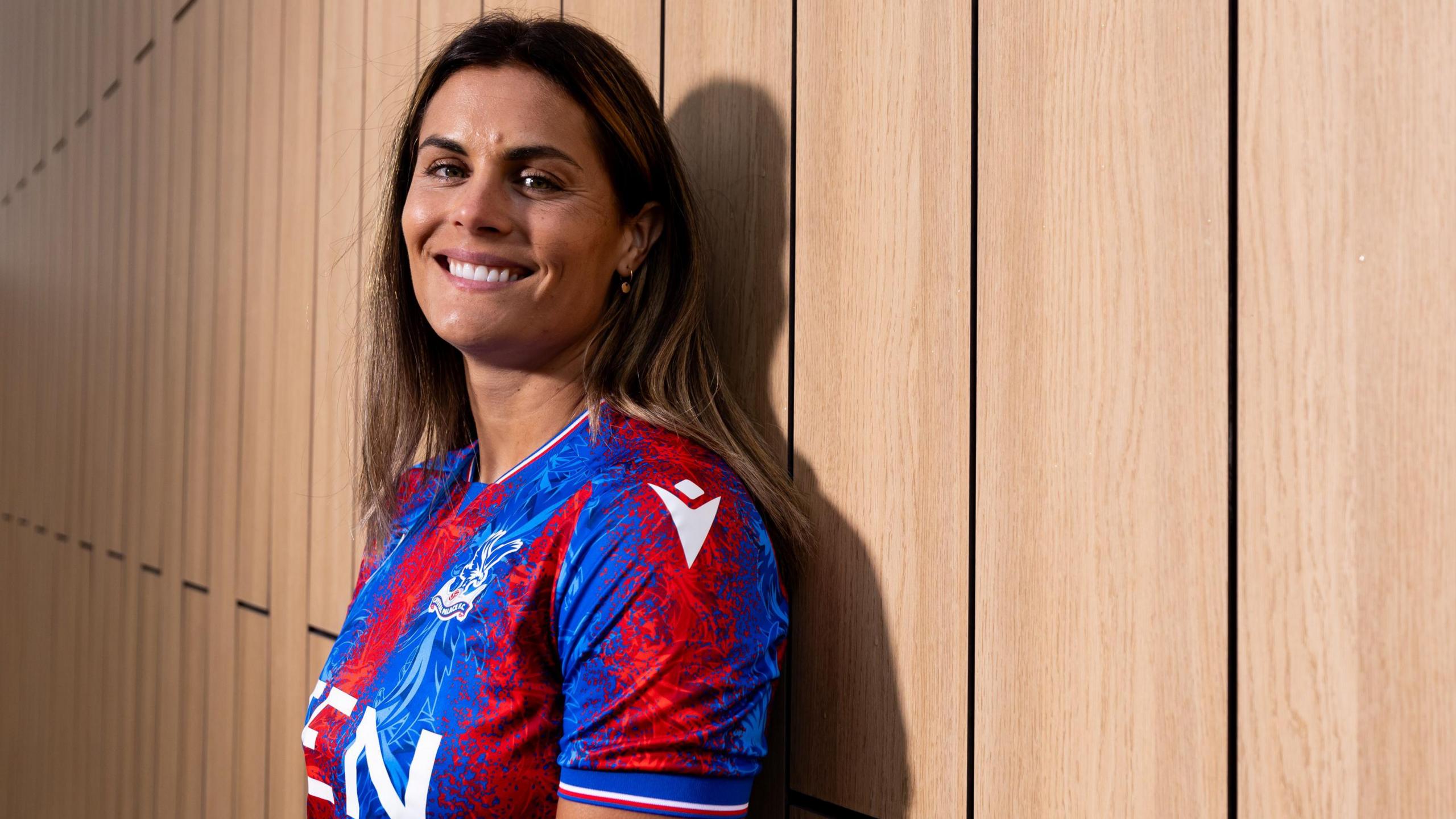 Katie Stengel in a Crystal Palace shirt