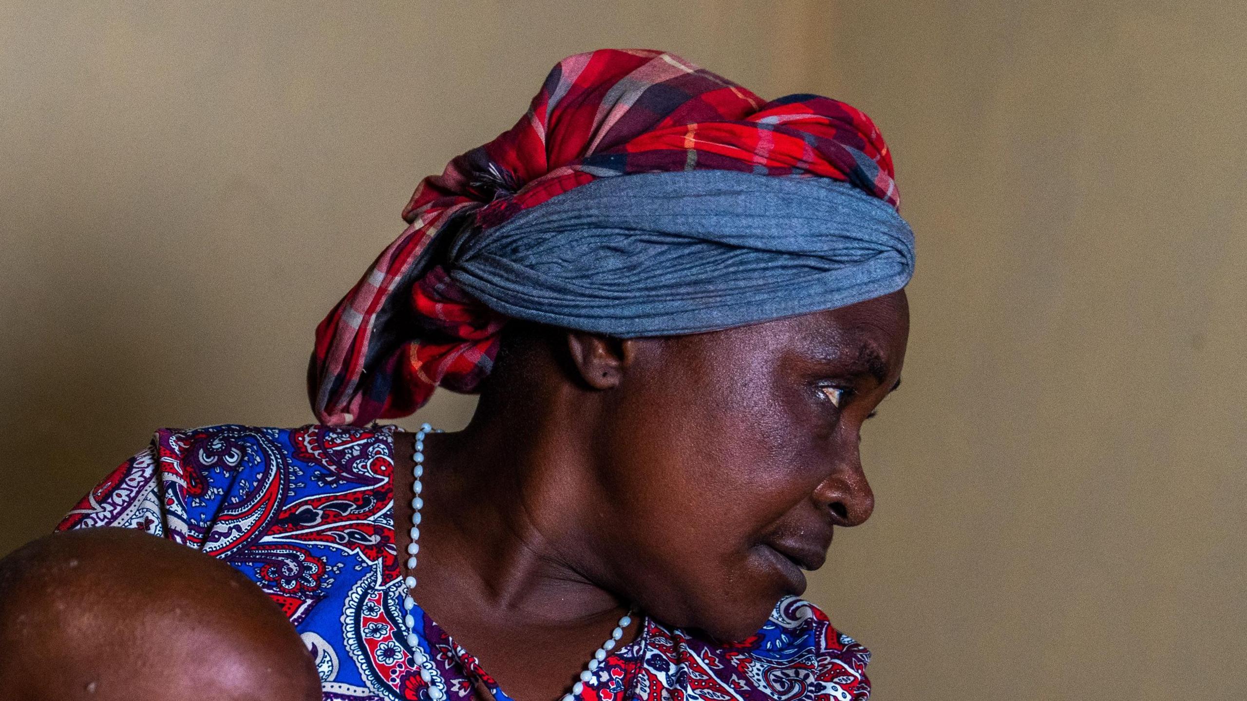 Beatrice Kachera holds a young child  in Lwiro hospital, DR Congo