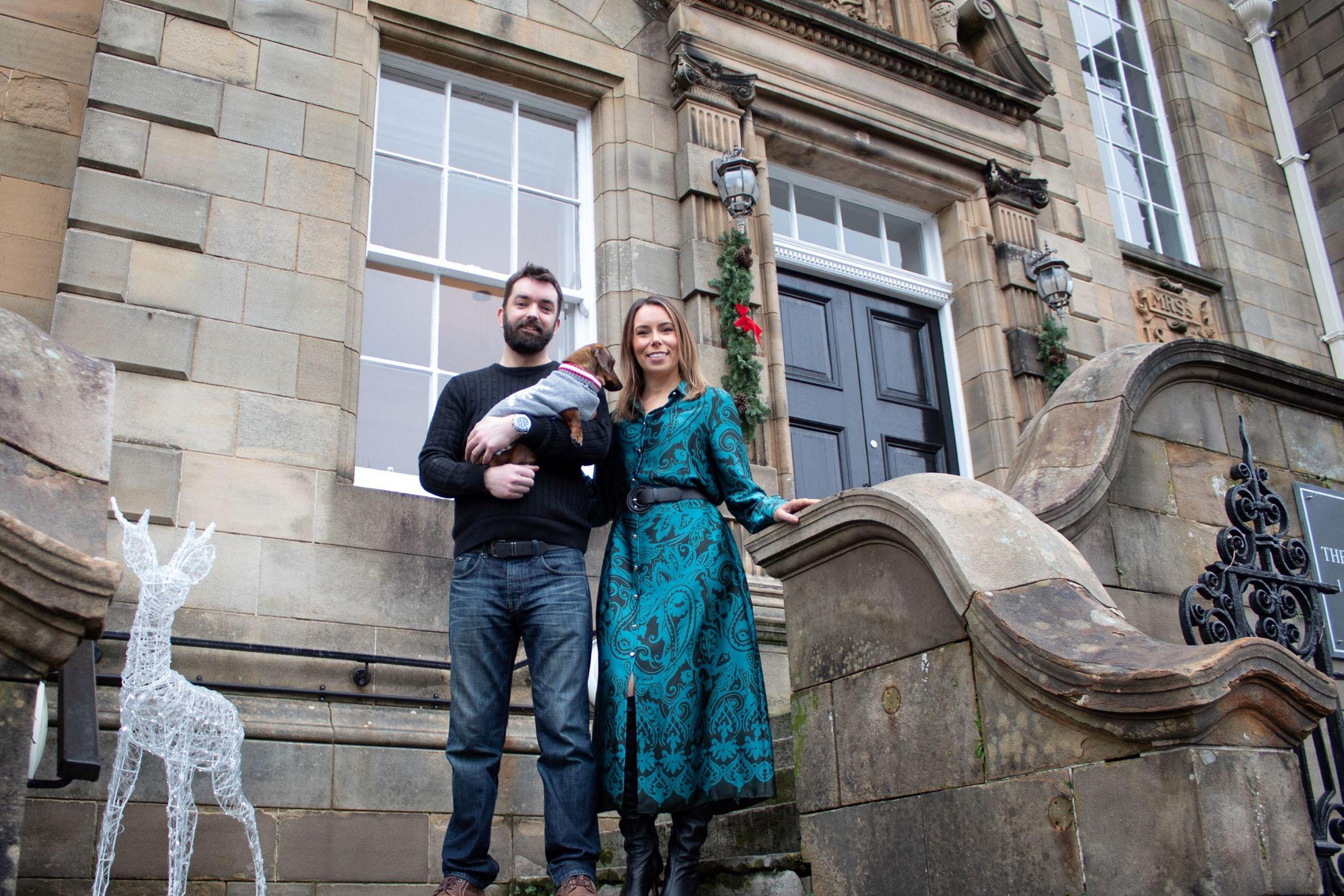 Hannah and Gordon outside their home