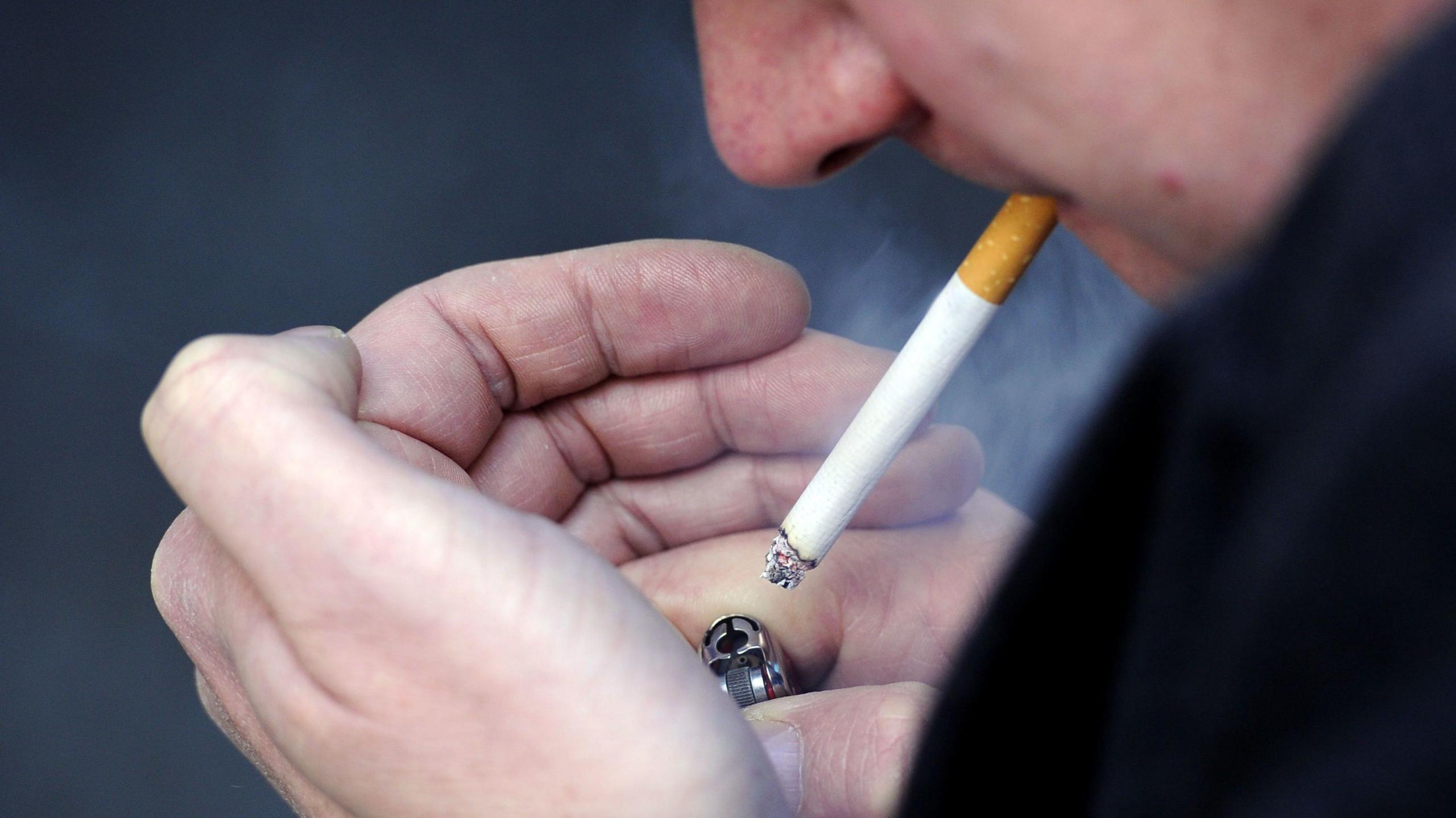 A man smoking a cigarette