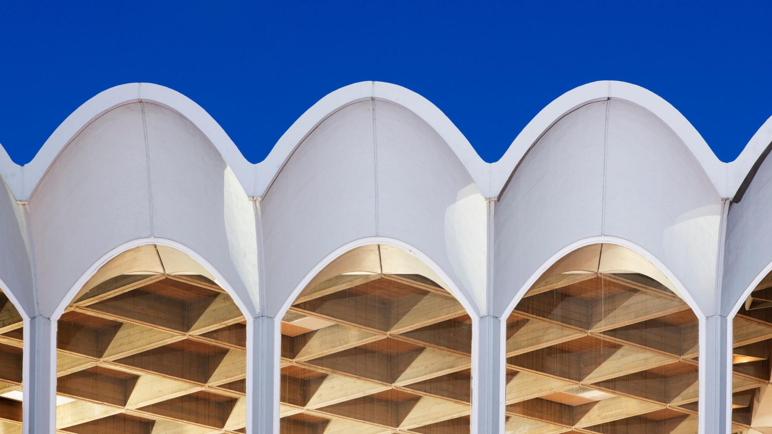 A 1960s white framed arched roof line above arched windows, Fitzwilliam College, Cambridge