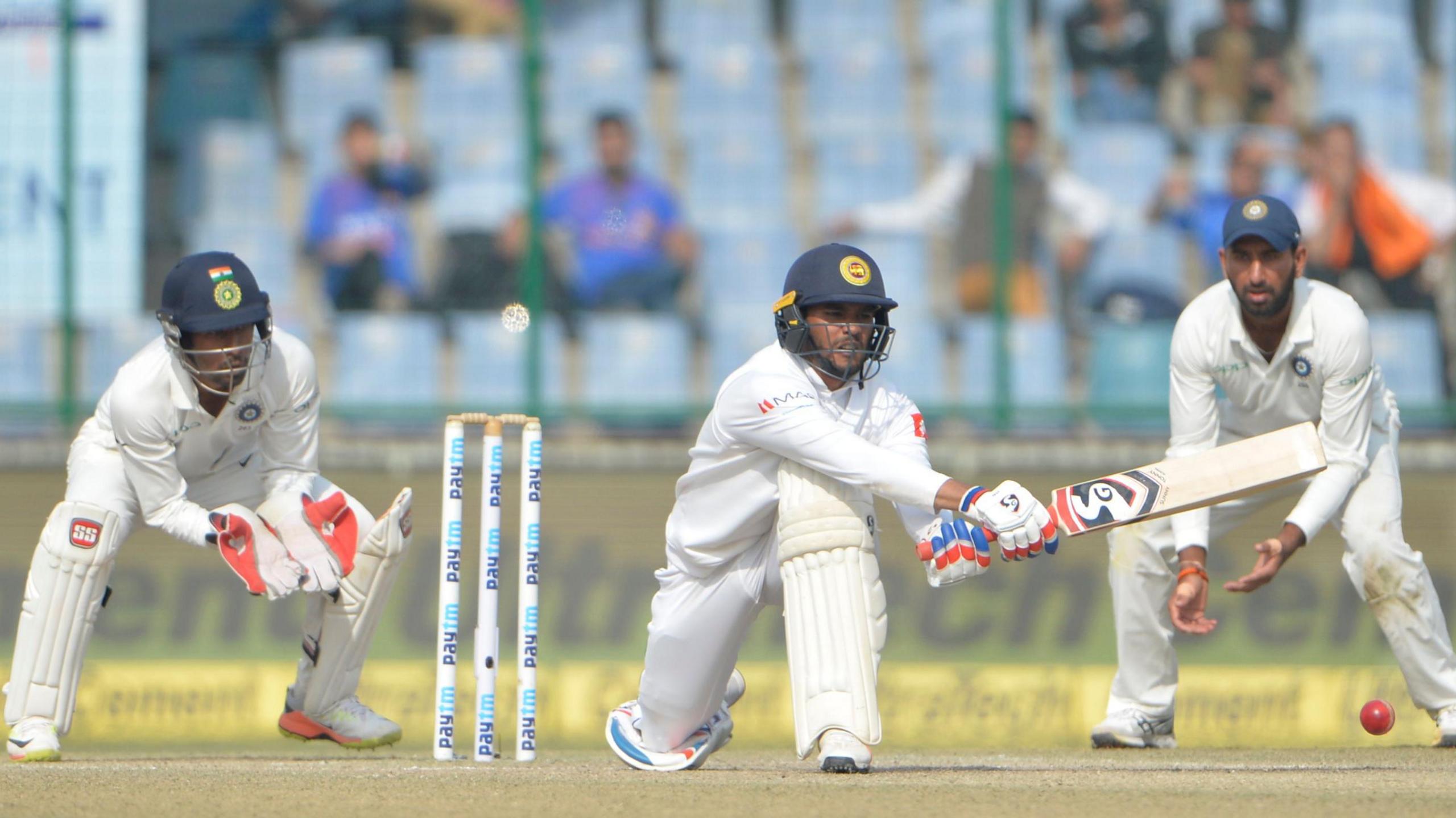 Sri Lanka's Dhananjaya de Silva plays a reverse sweep shot in a Test against India in 2017