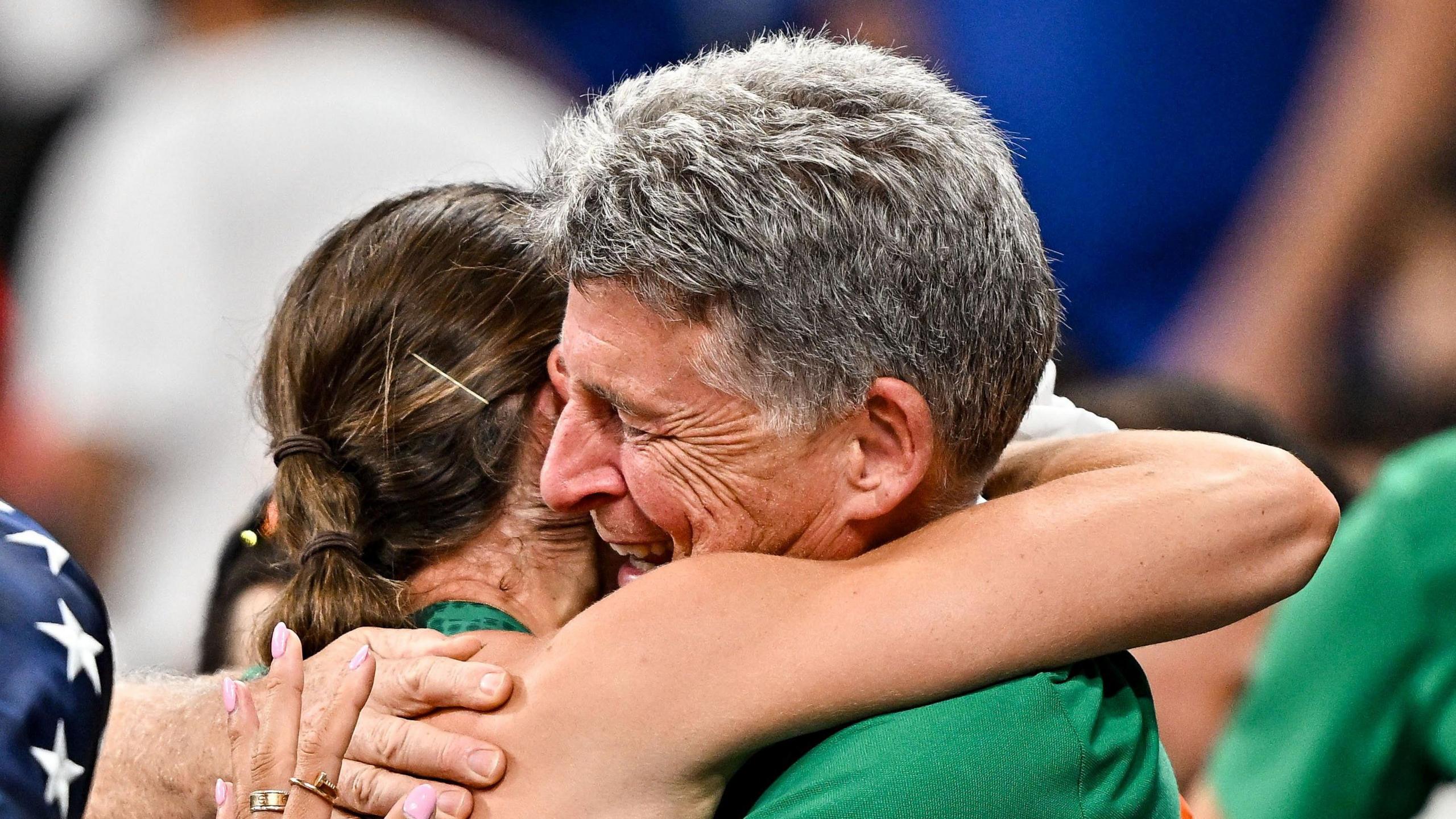 Kate O'Connor hugs her father and coach Michael O'Connor