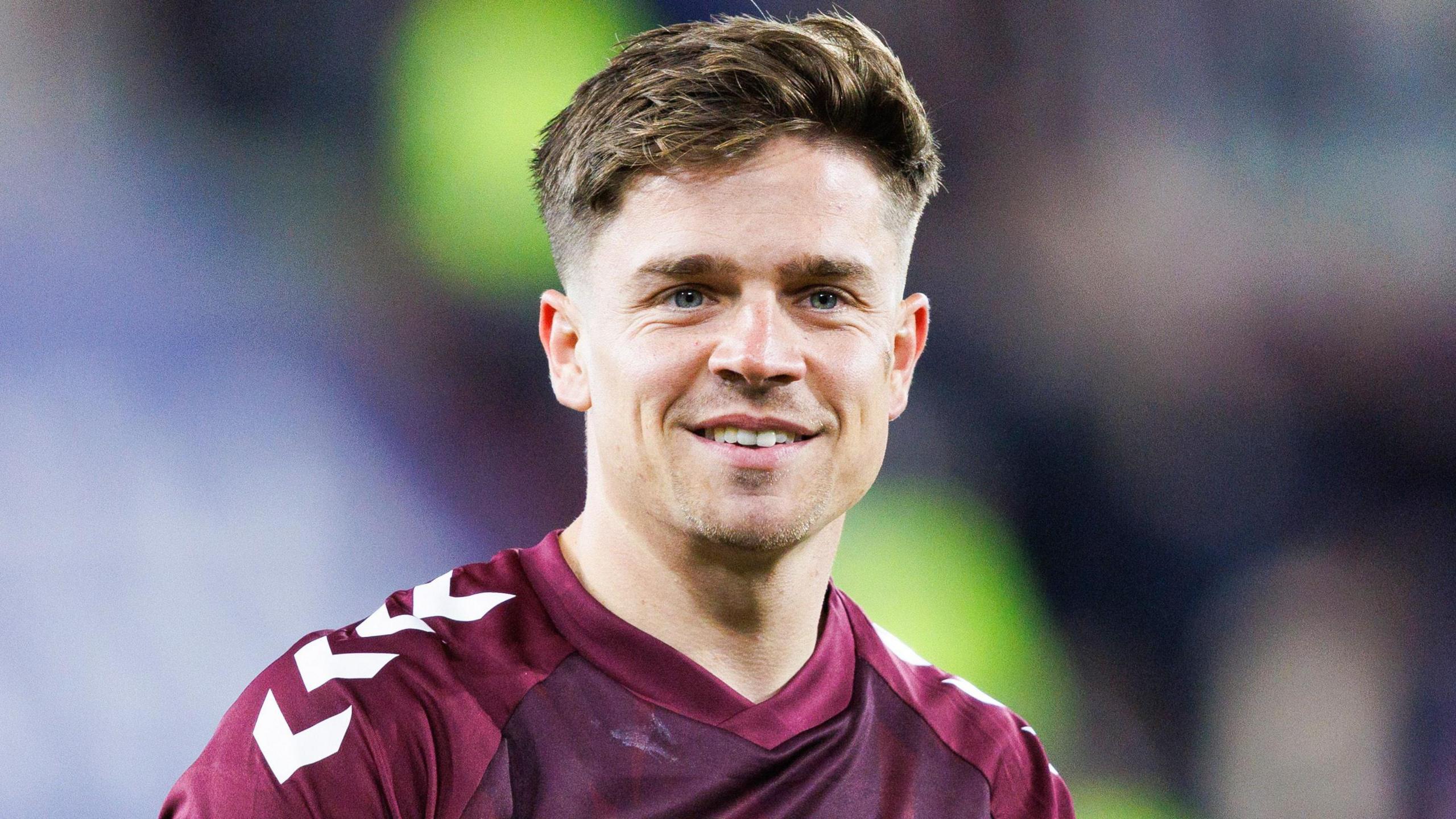 Hearts midfielder Cammy Devlin