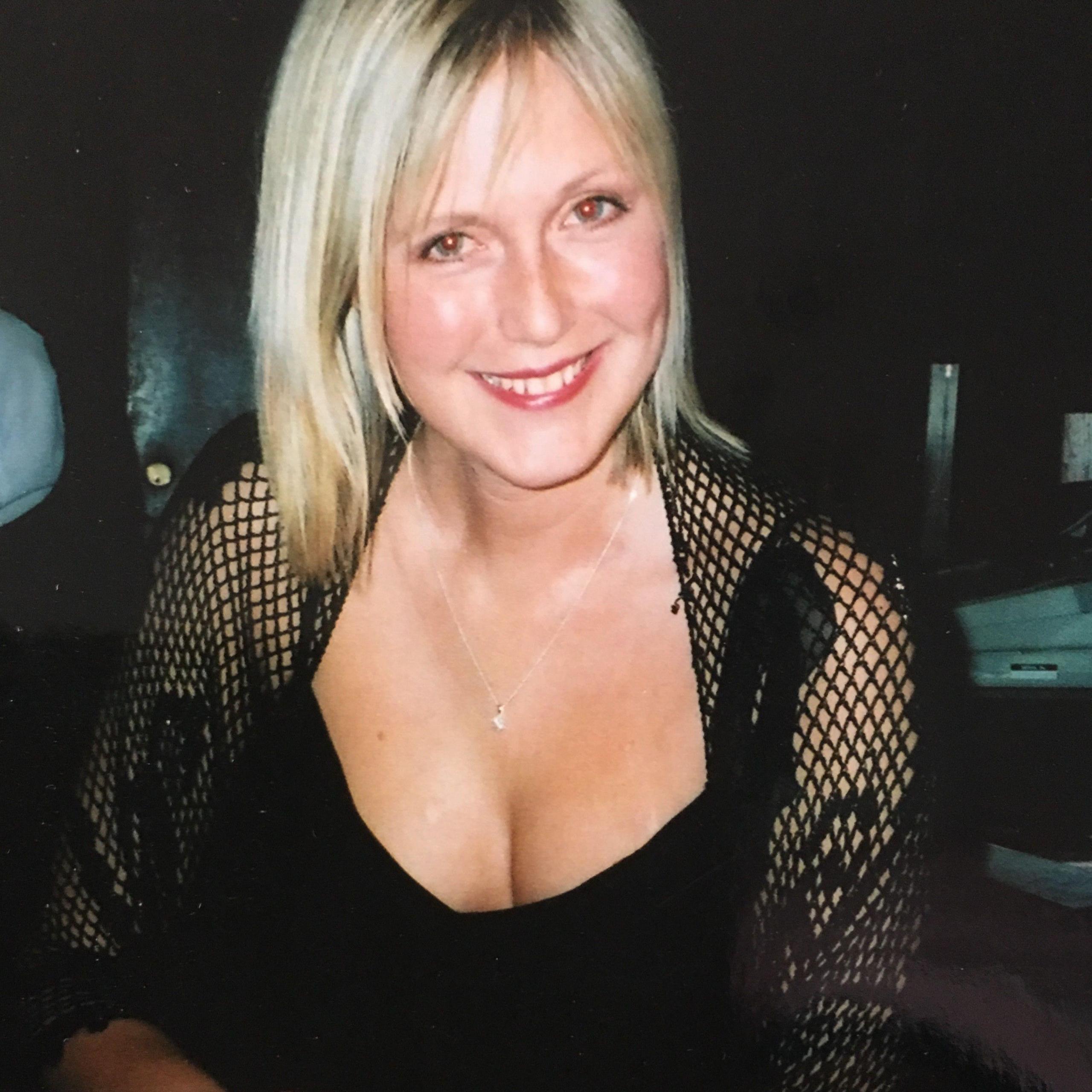 Smiling, blonde-haired Johanna MacVicar wearing a black dress