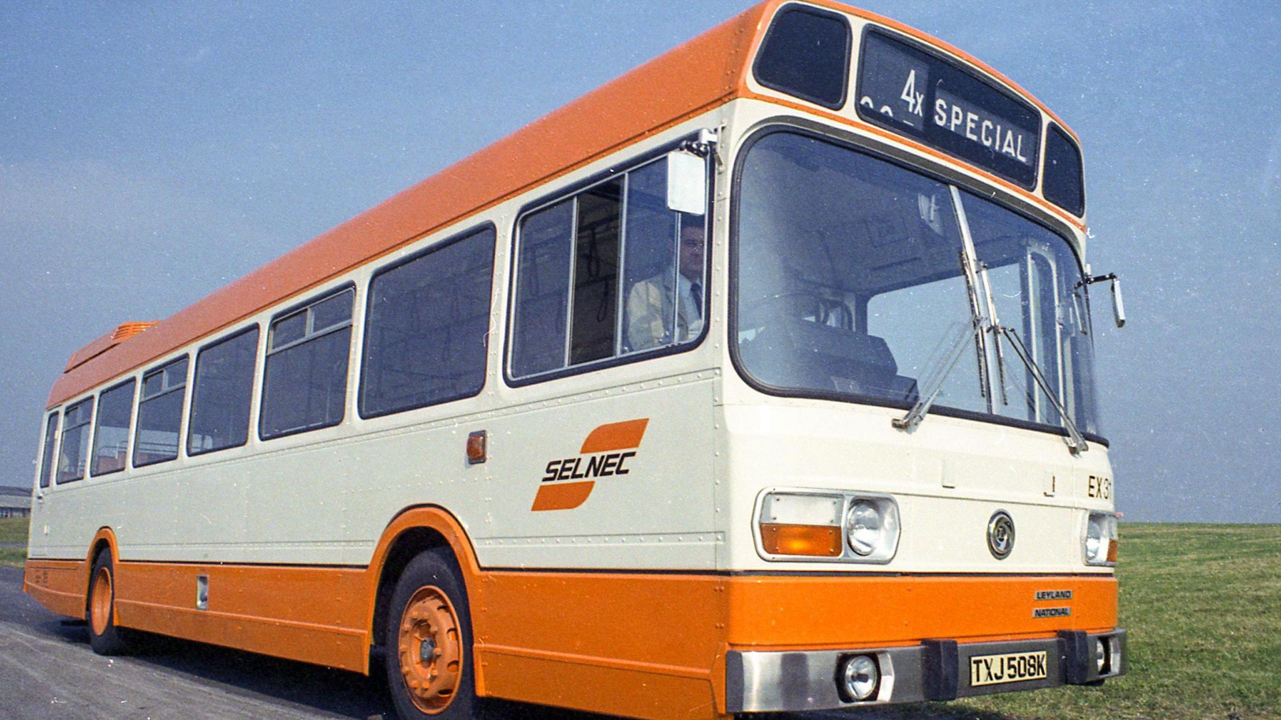 A single decker SELNEC branded bus