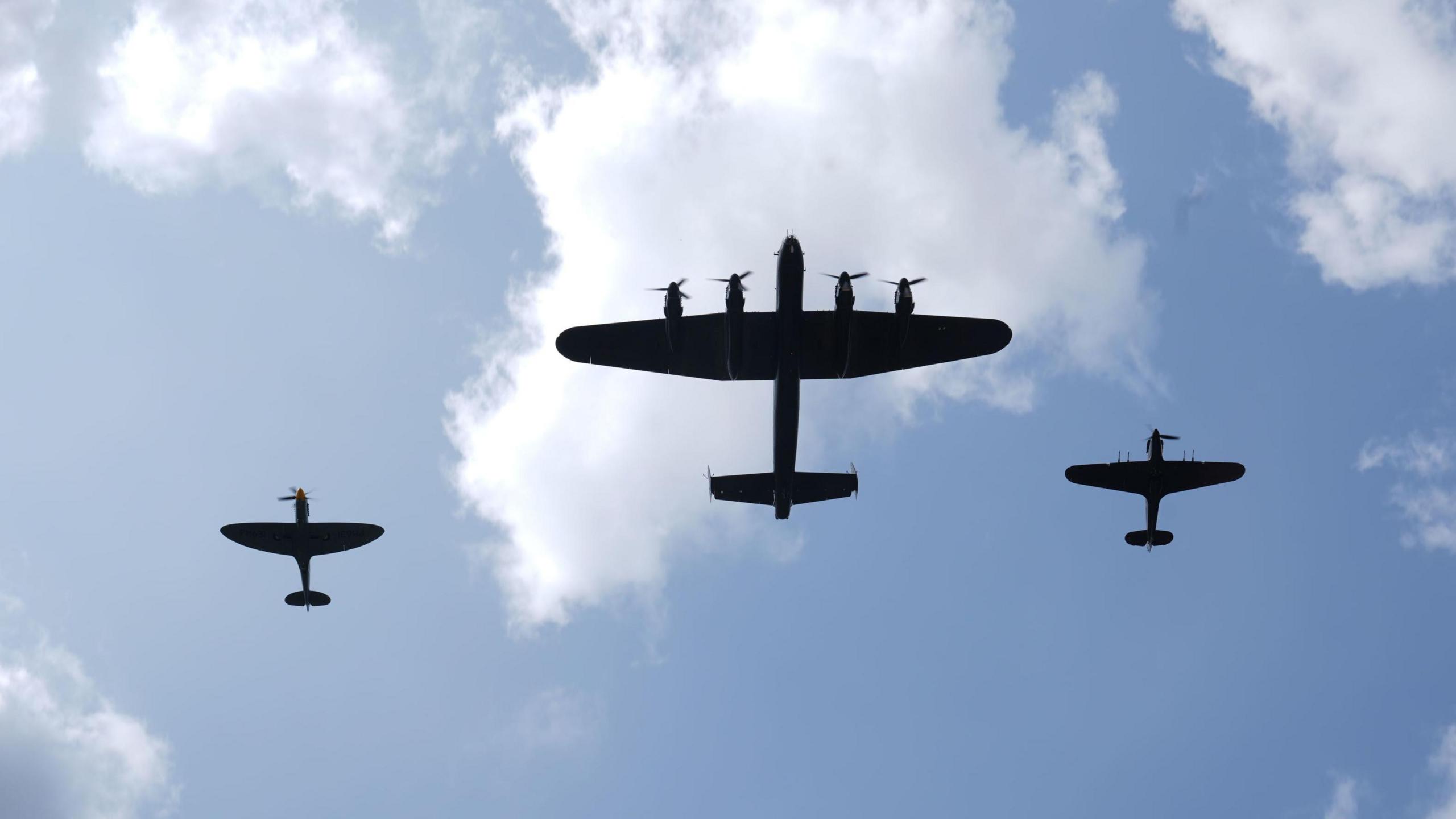 three planes fly over the event