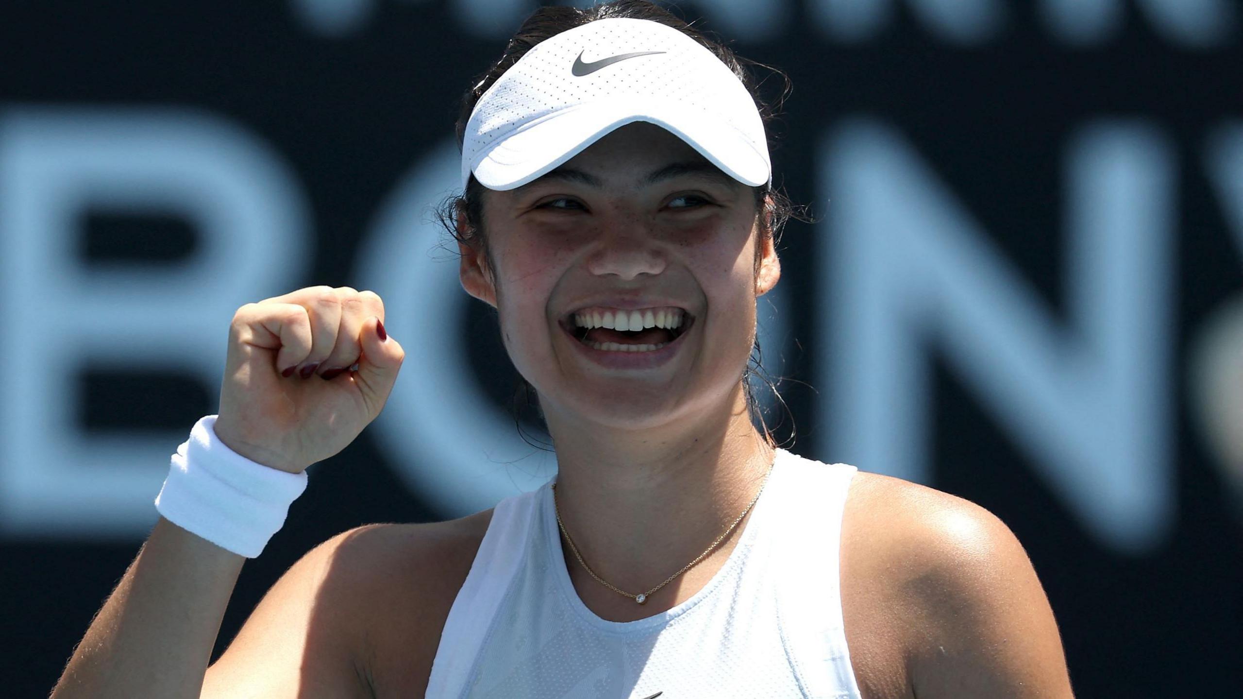 Emma Raducanu laughs after securing victory after the Australian Open first round