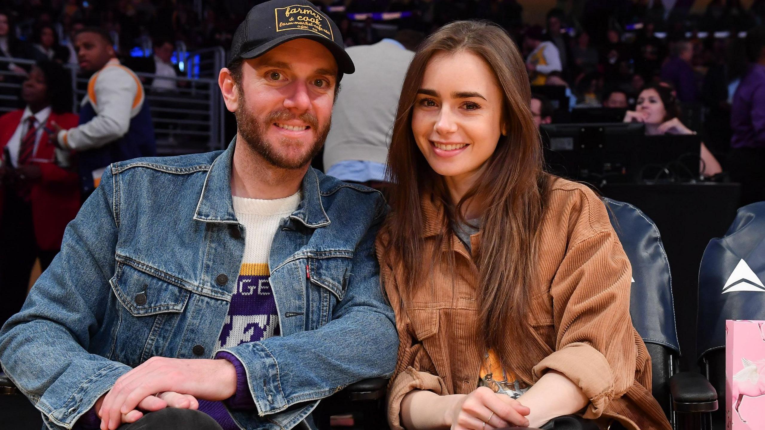 Lily Collins and Charlie McDowell attend a basketball game