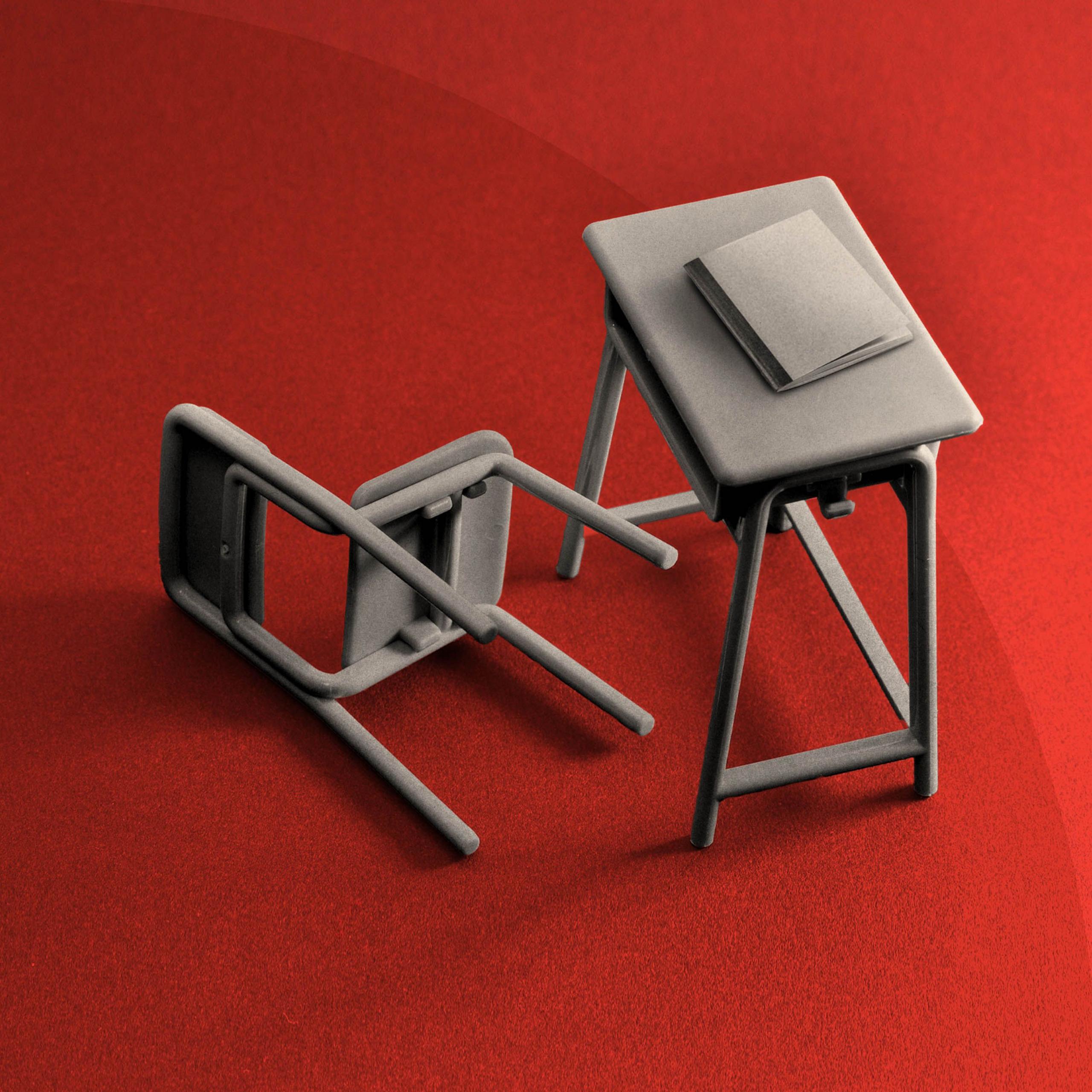 A treated image of a desk with a chair toppled over