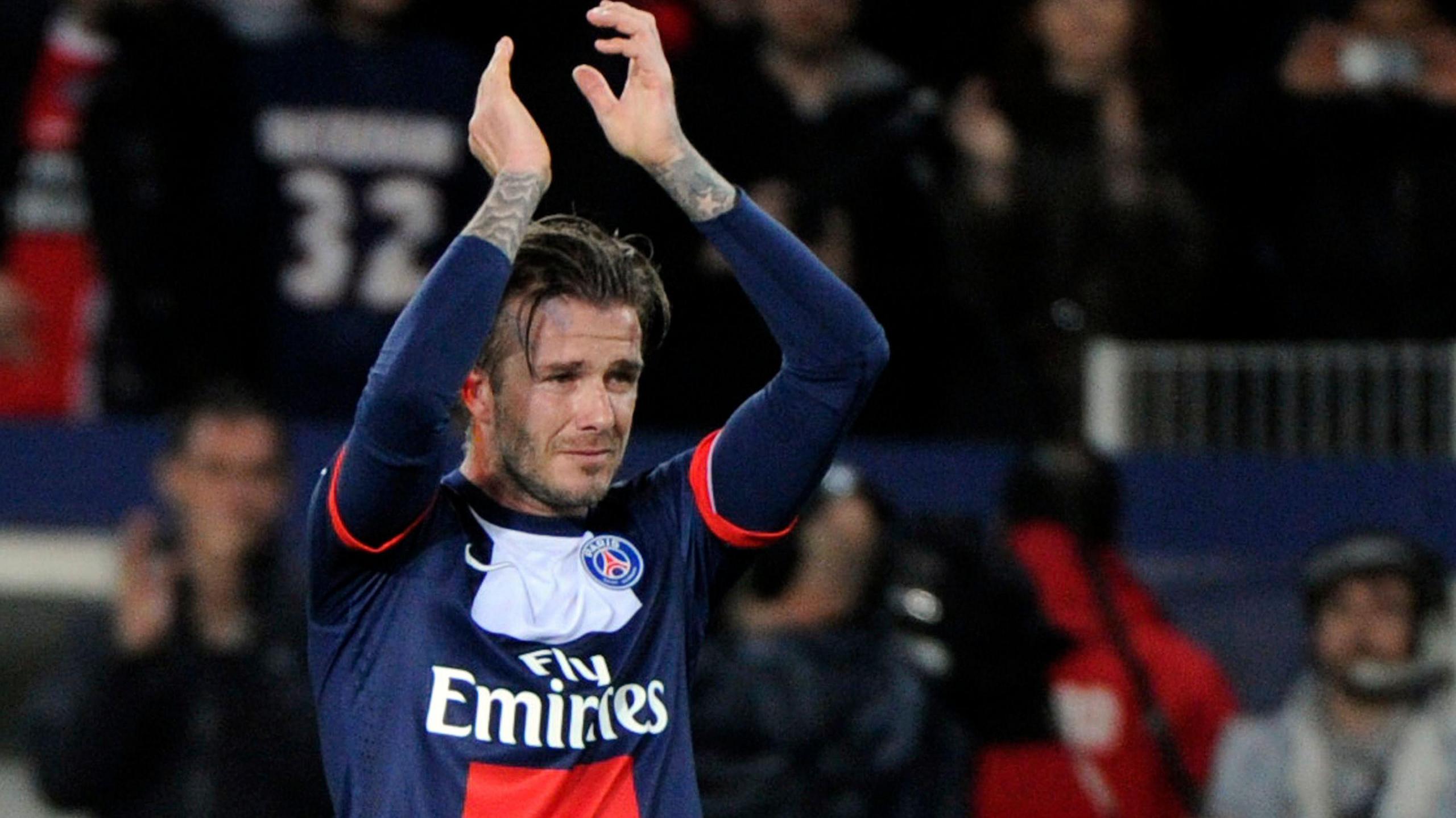 David Beckham in tears as he applauds fans during the final match of his career at PSG