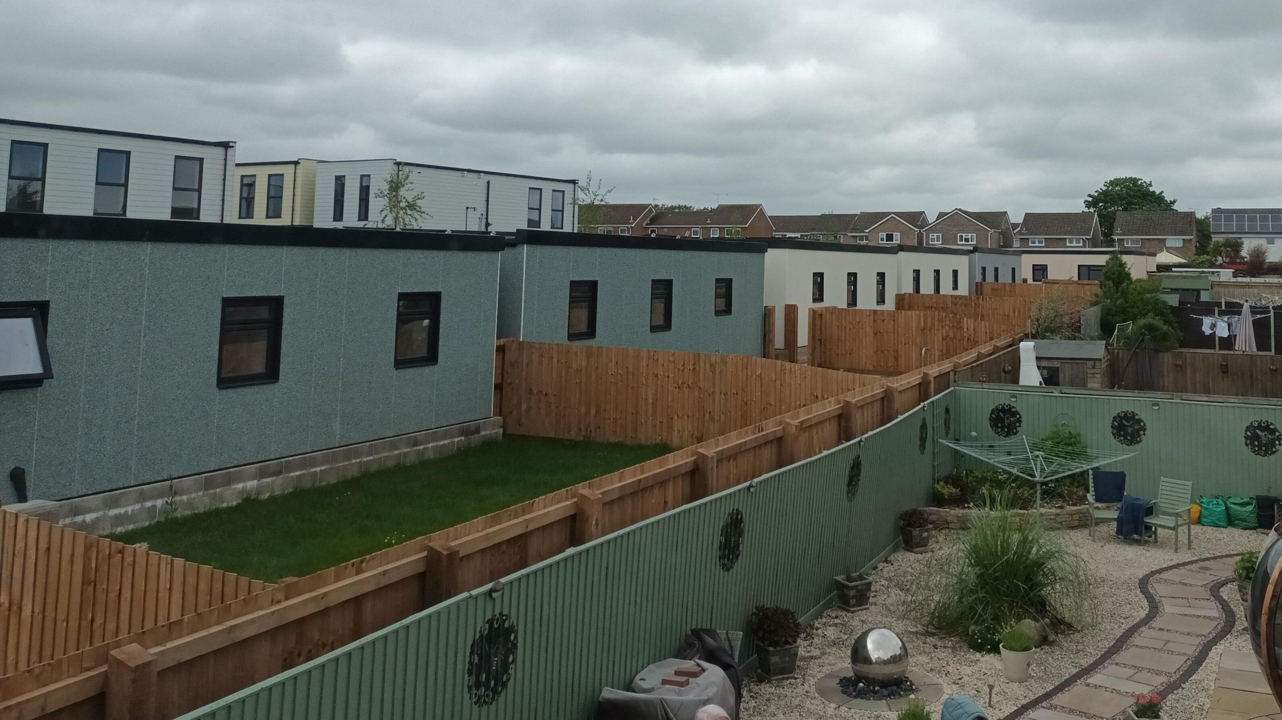 A view of the portable homes from the window of a nearby house