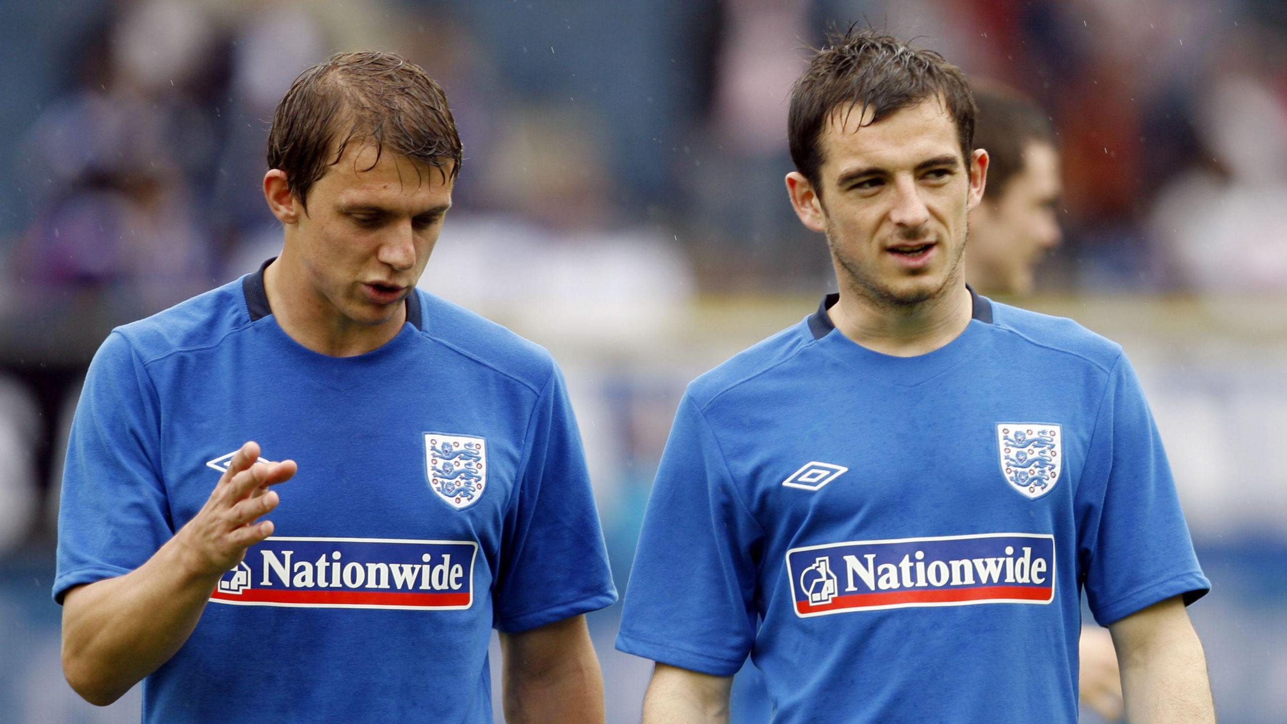 Stephen Warnock (left) and Leighton Baines warm up before England's pre-World Cup friendly against Japan in Austria in May 2010