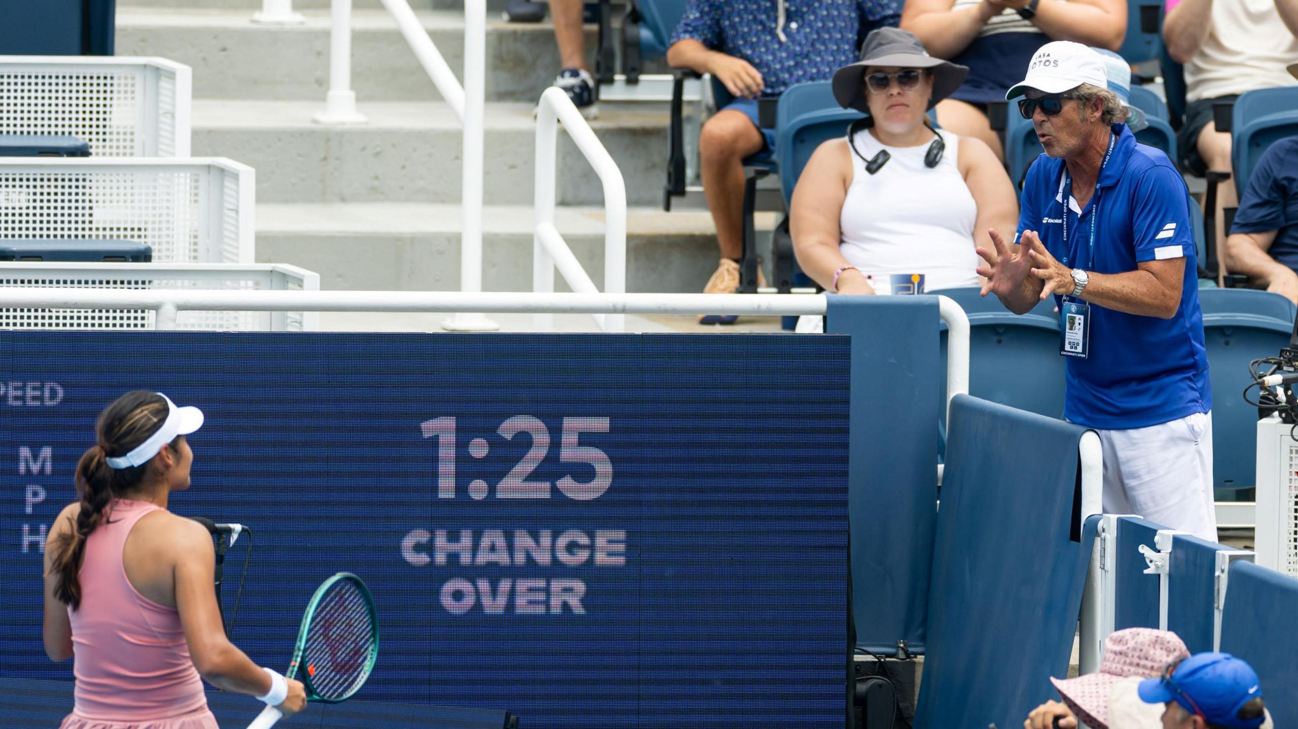 Emma Raducanu takes instruction from Francisco Roig during her Cincinnati Open match against Aryna Sabalenka
