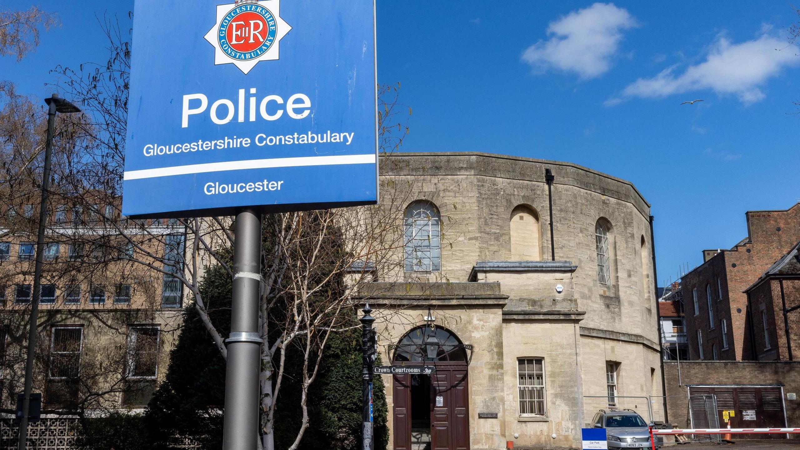 Entrance to court with police sign outside