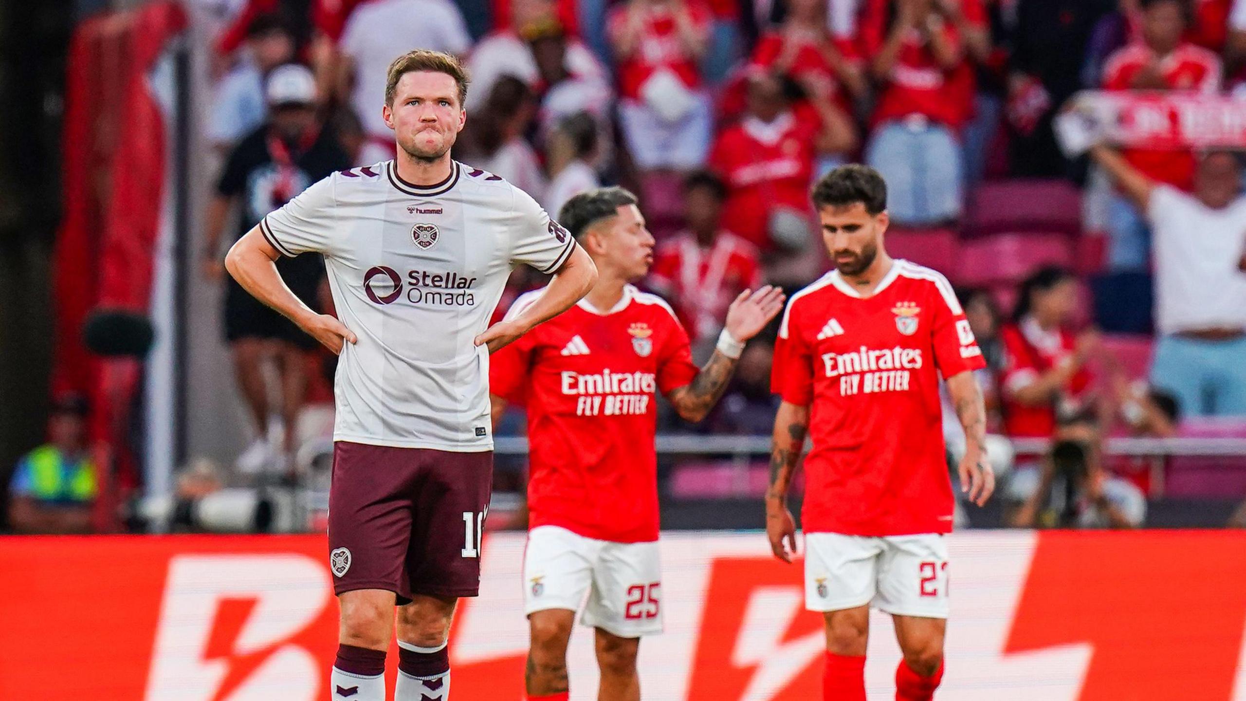Blair Spittal cuts a dejected figure after another Benfica goal