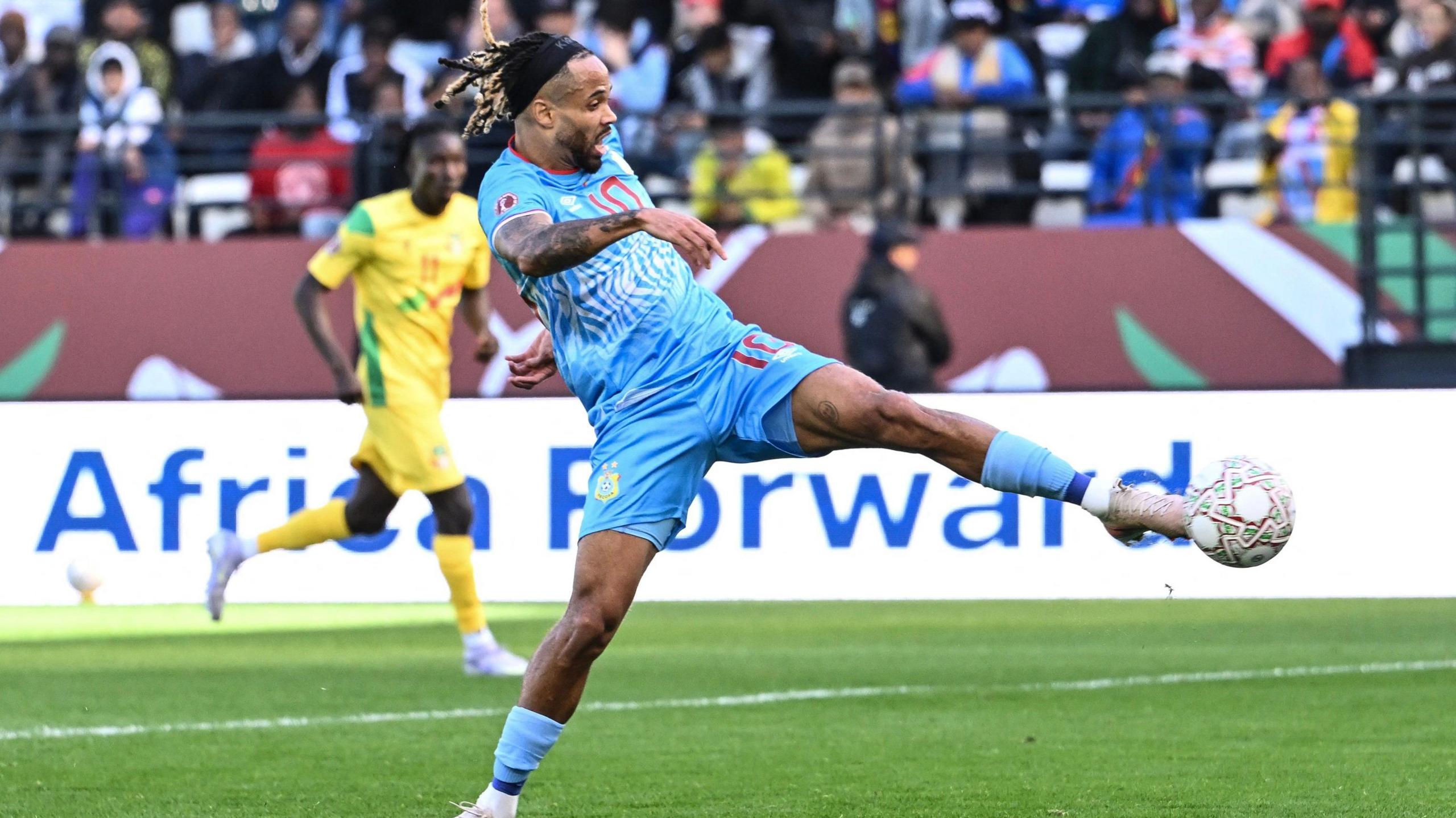 DR Congo's Theo Bongonda stretches out his left foot to volley a football against Benin