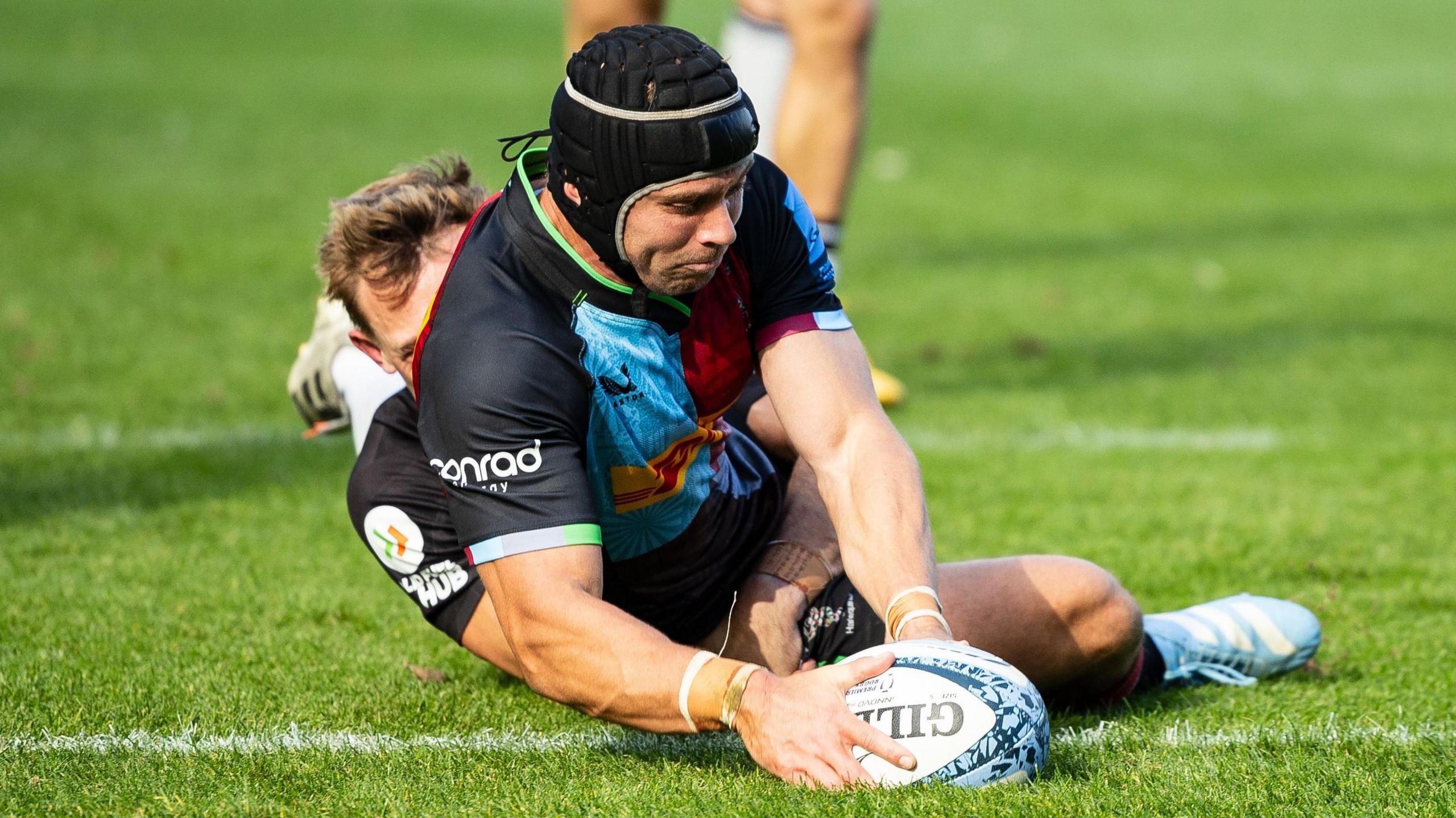 Leigh Halfpenny dots down for Harlequins' third try against Newcastle Falcons