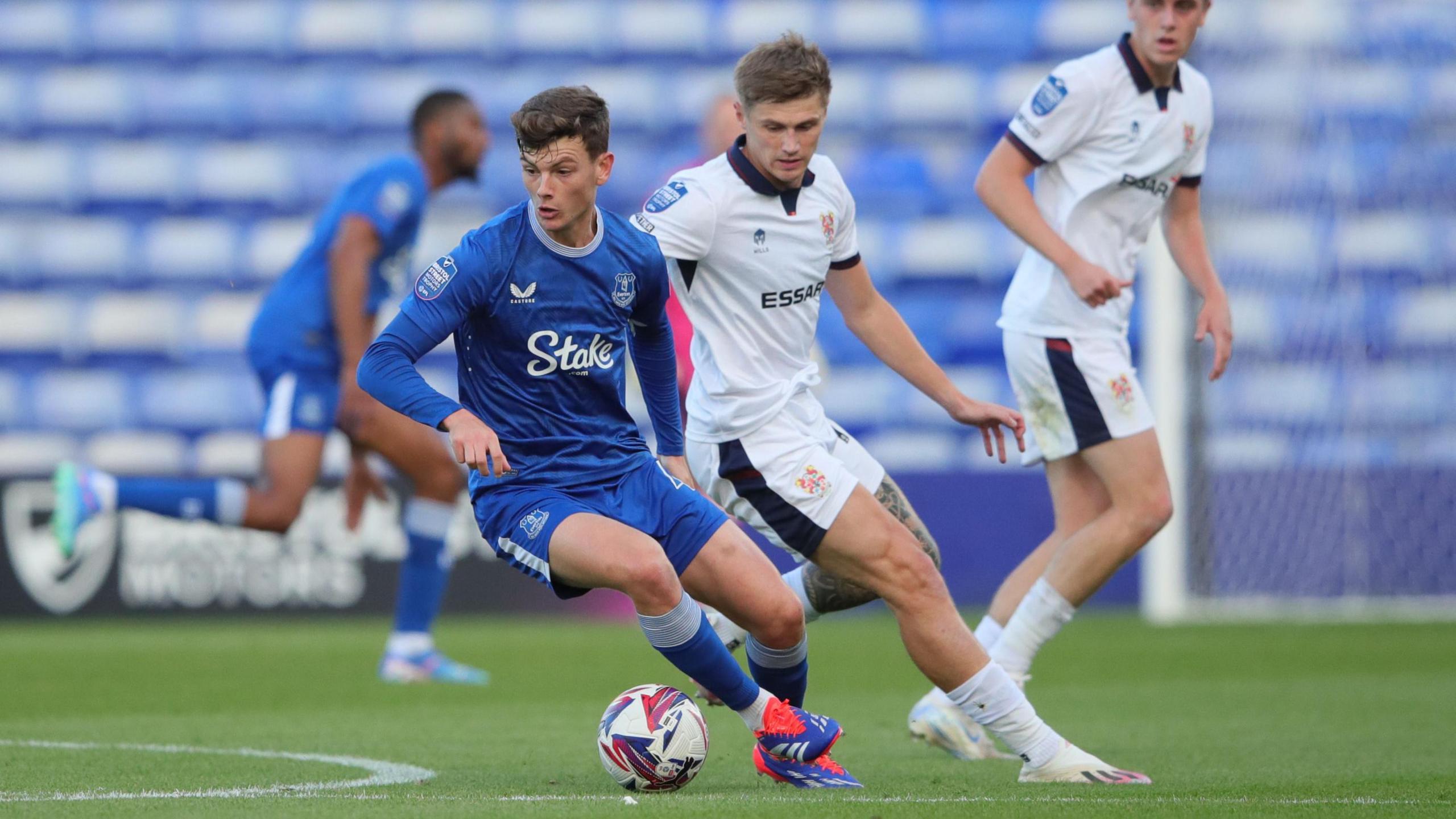 Everton Under-21s player is challenged for the ball