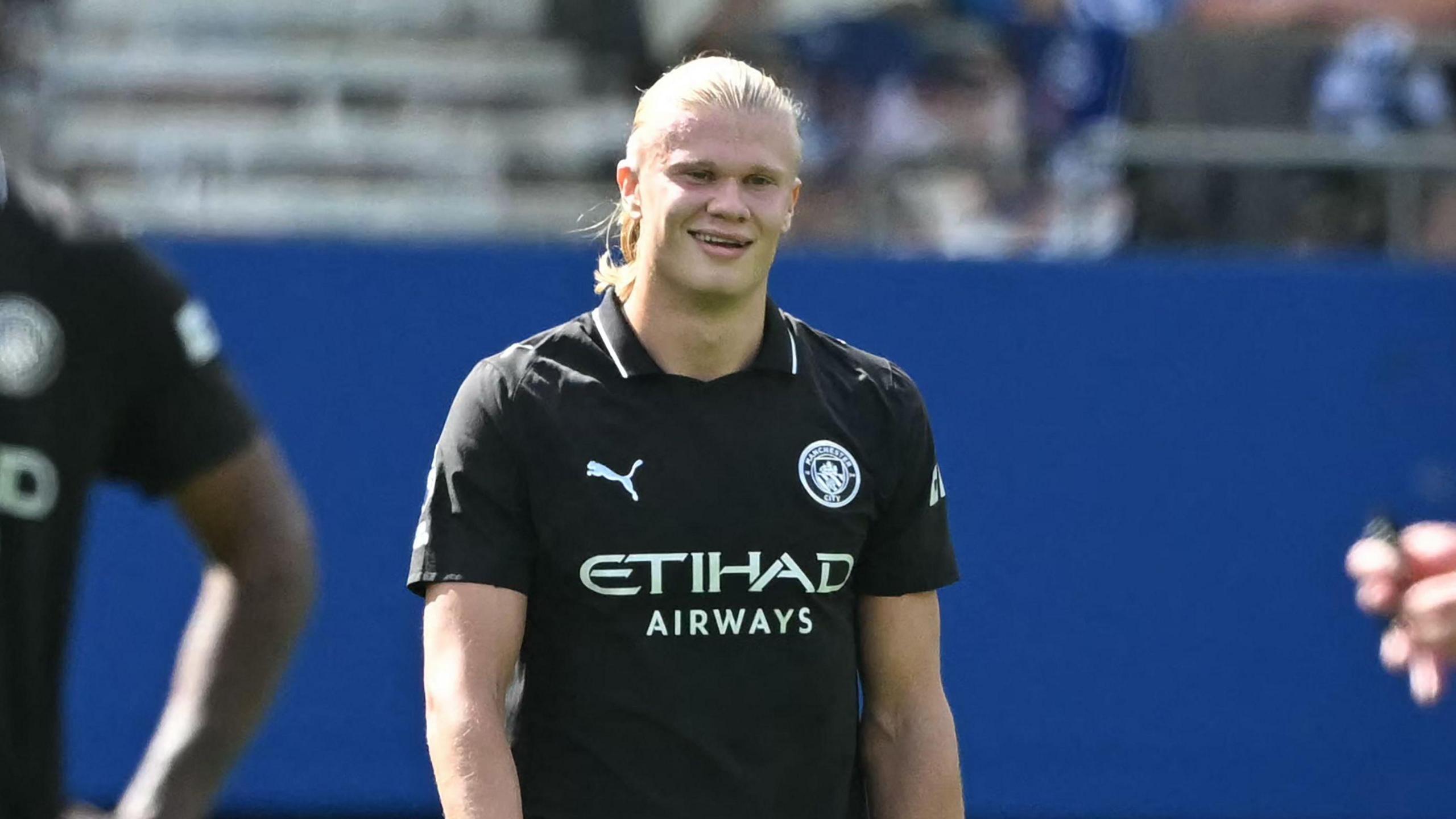 Erling Haaland smiles during Manchester City lucifer against Brighton