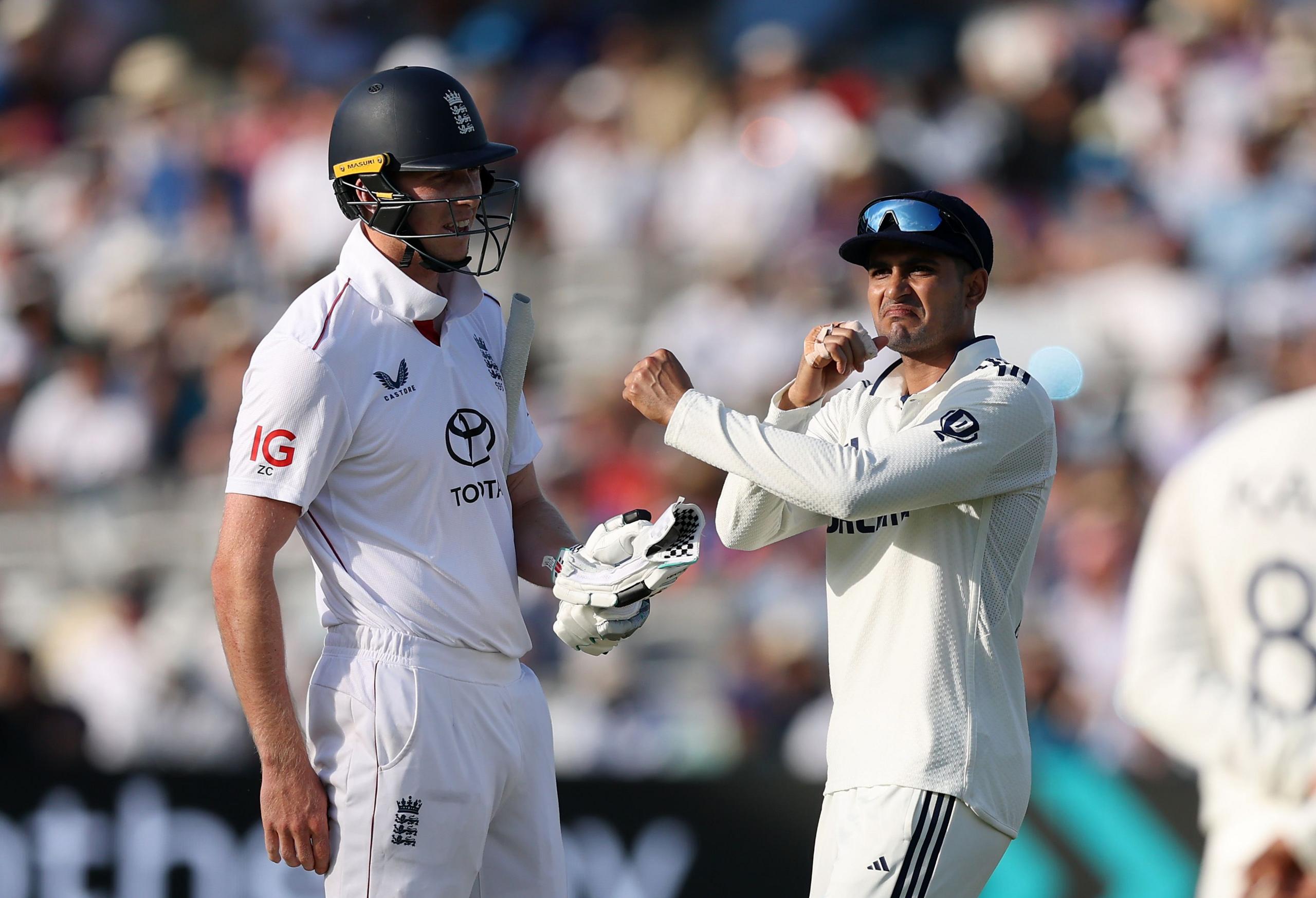 Shubman Gill makes an X gesture to Zak Crawley after England opener calls for physio