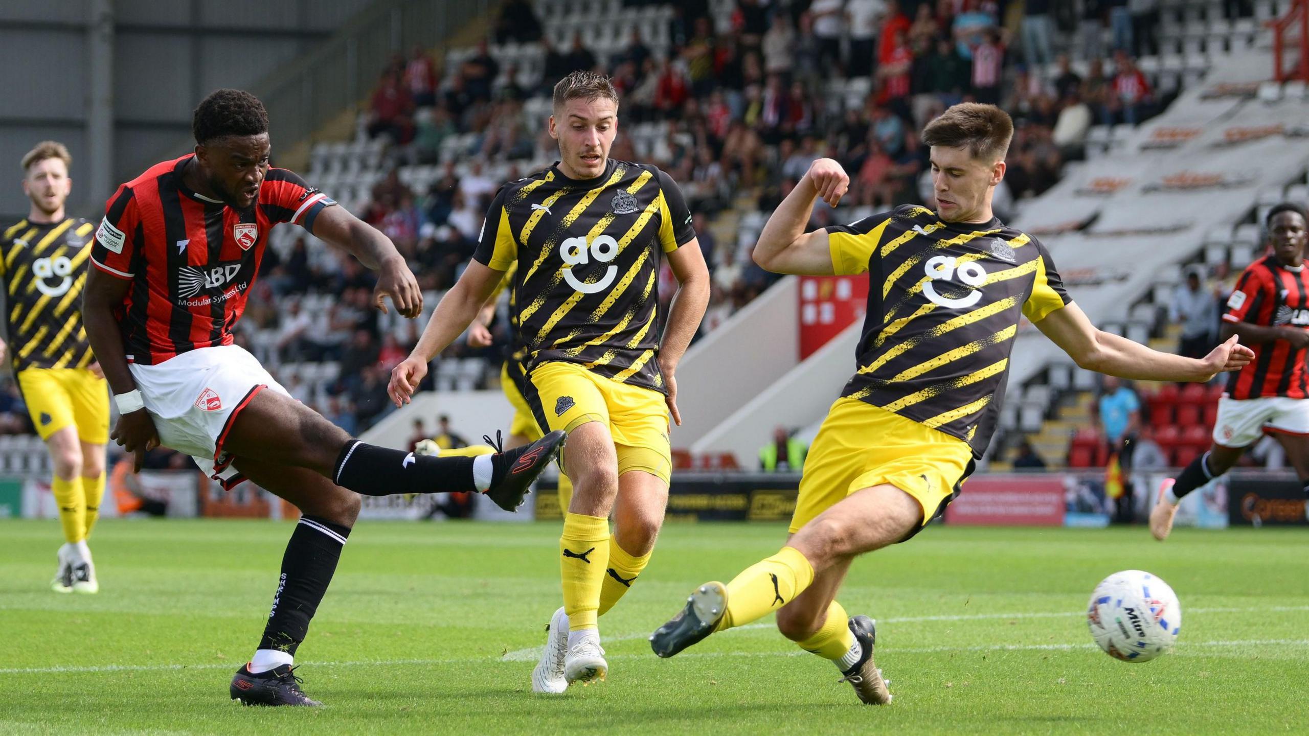 Daniel Ogwuru scores Morecambe's winning goal against Altrincham