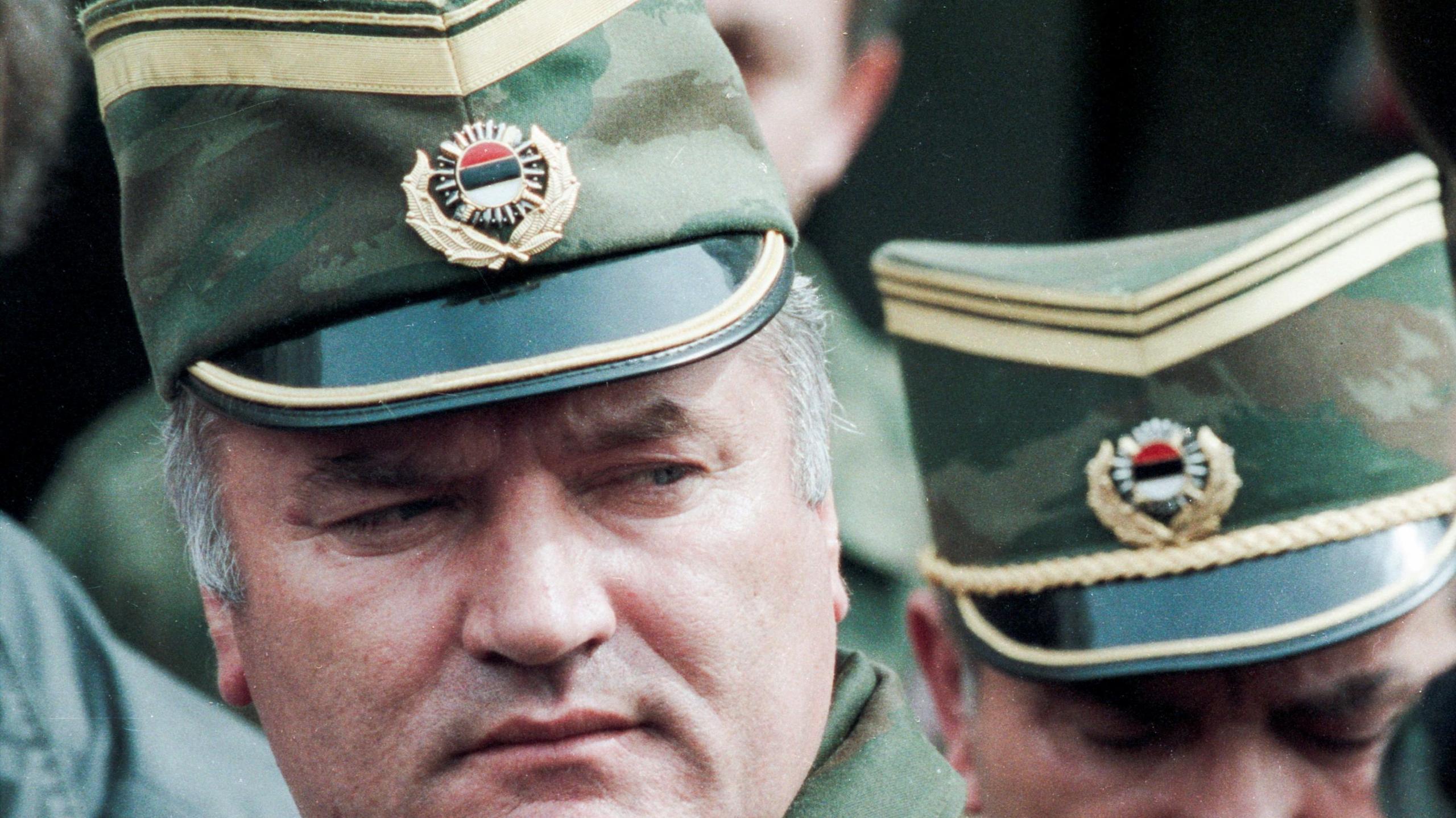 Bosnian Serb General Ratko Mladic leaves a meeting at the airport in Sarajevo, Bosnia and Herzegovina April 13, 1993. He is wearing a green and gold military peaked cap. 