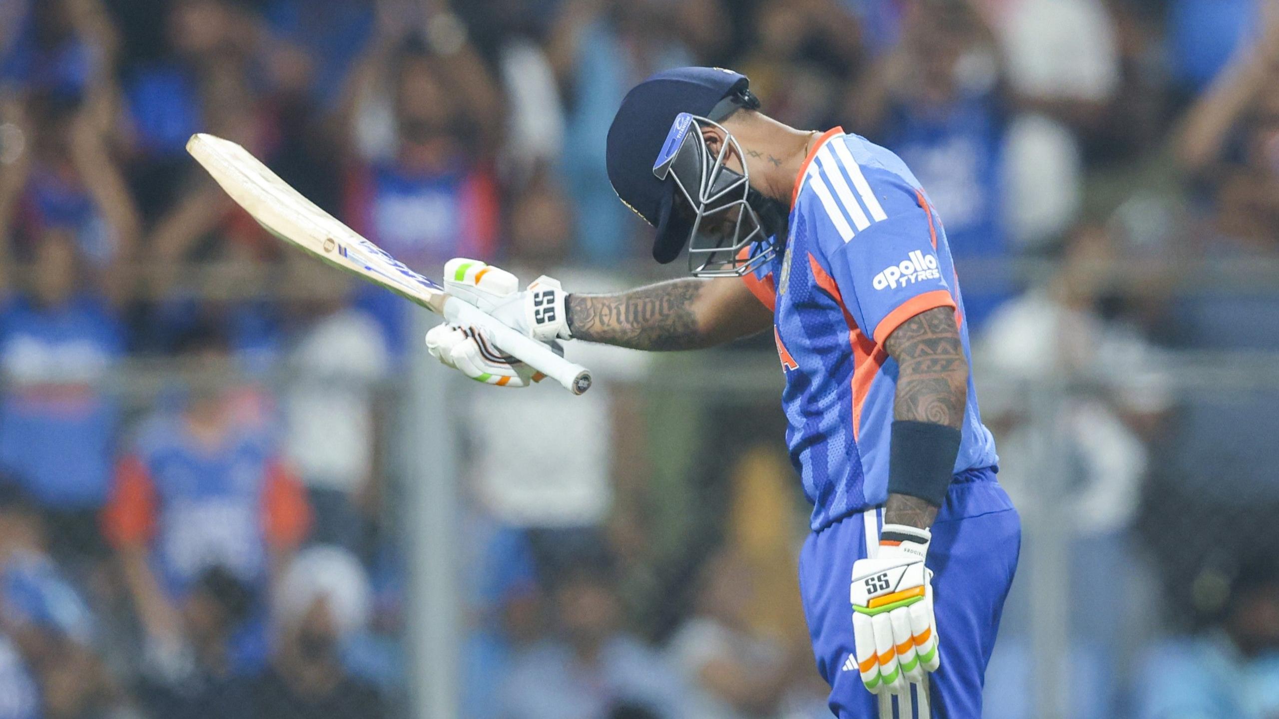 Suryakumar Yadav bows after hitting a half-century