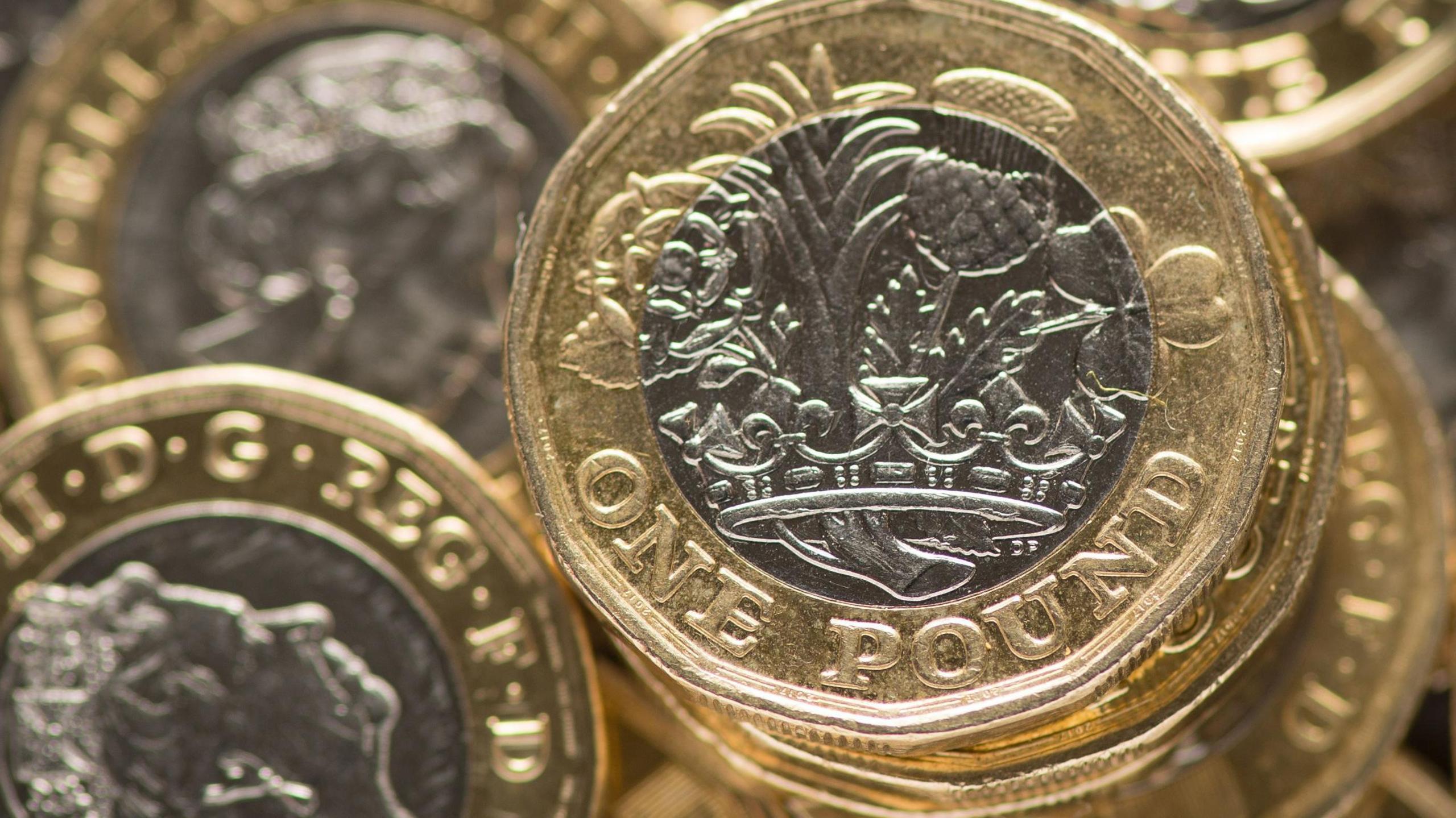 A pile of £1 coins.