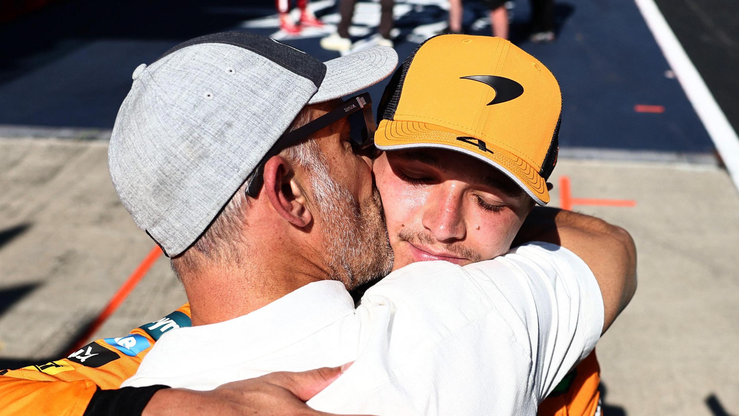 Lando Norris and his dad sharing an embrace after his race victory in Austria