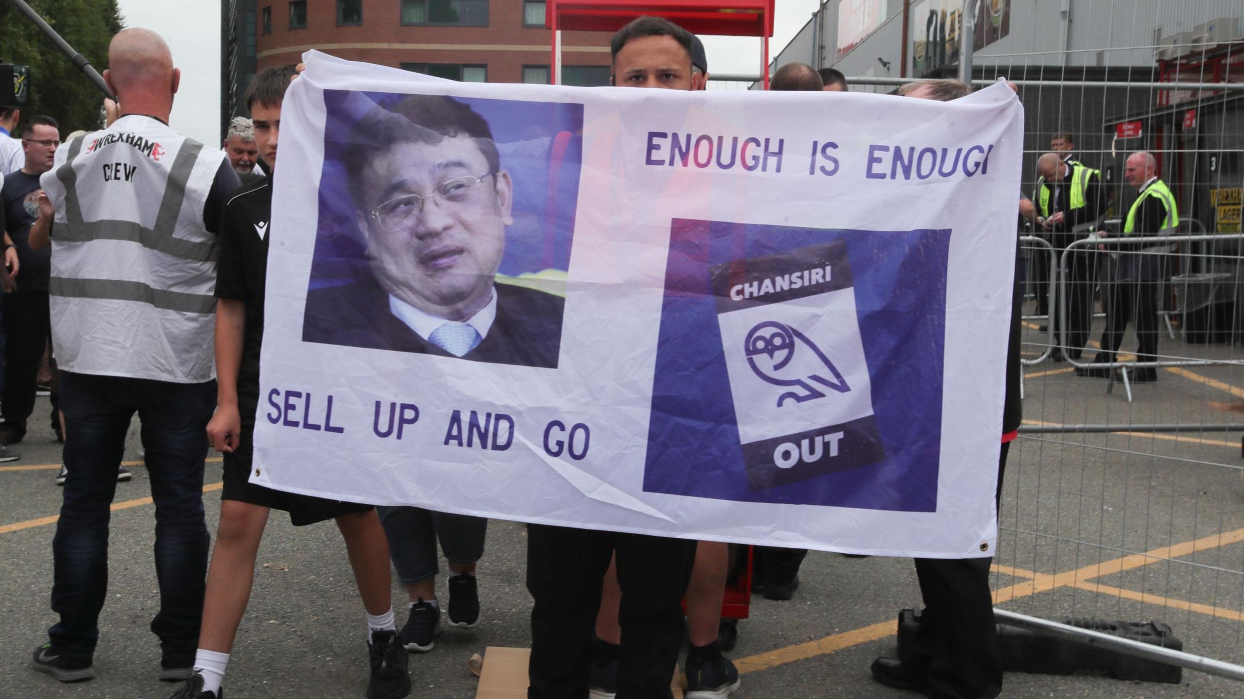 Sheffield Wednesday fans hold up a banner