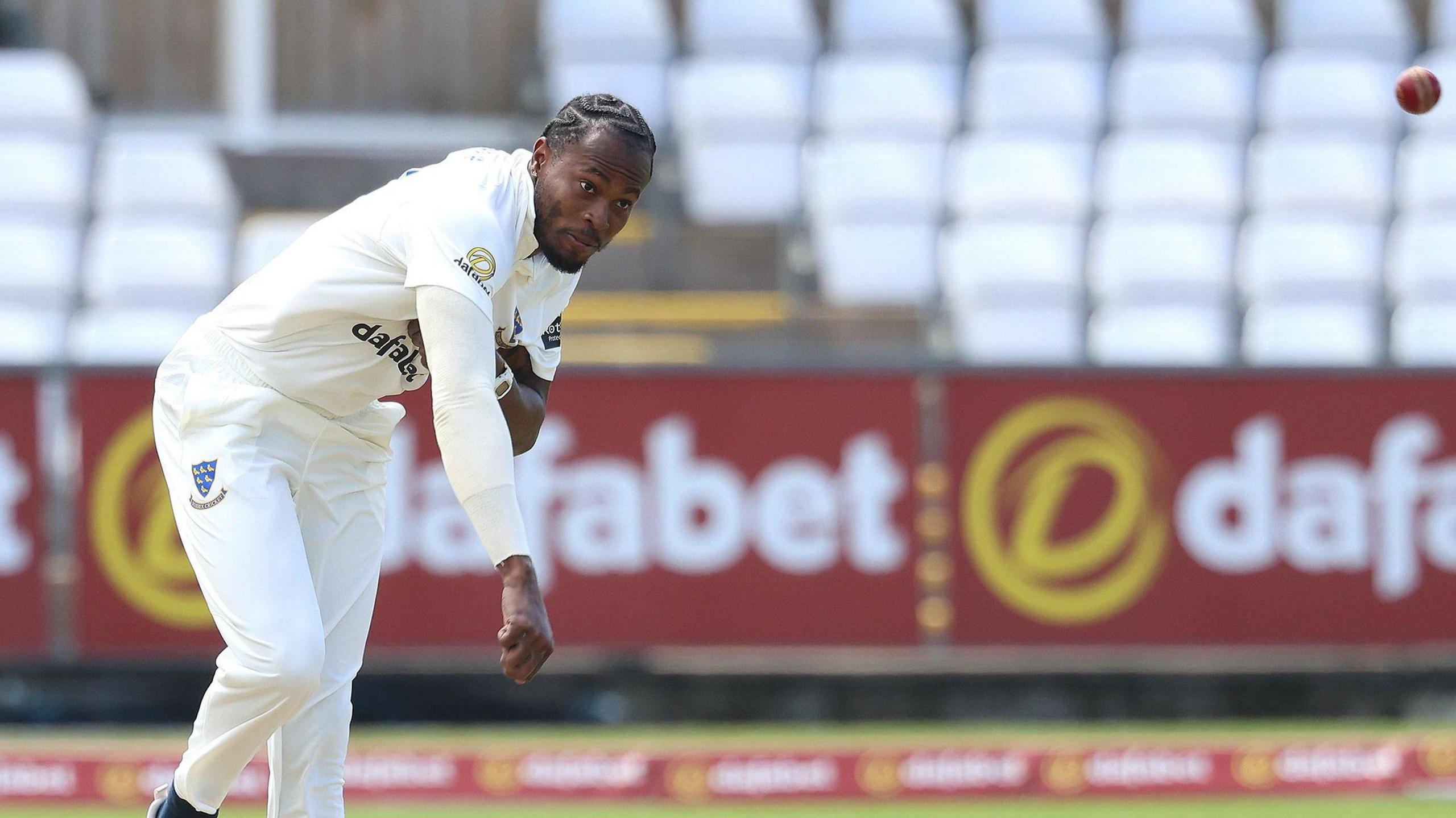 Jofra Archer bowls for Sussex