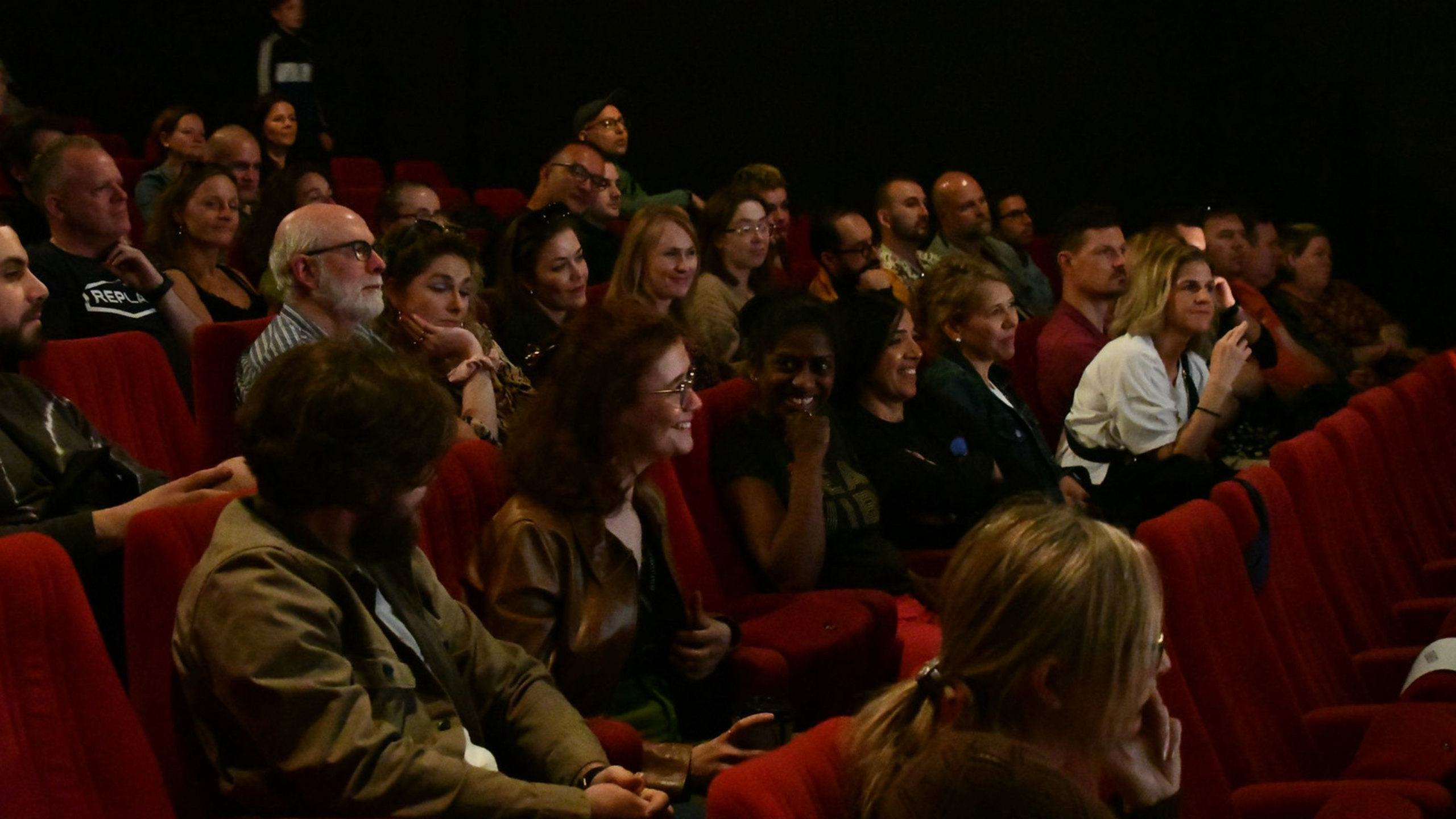 People laughing in a theatre