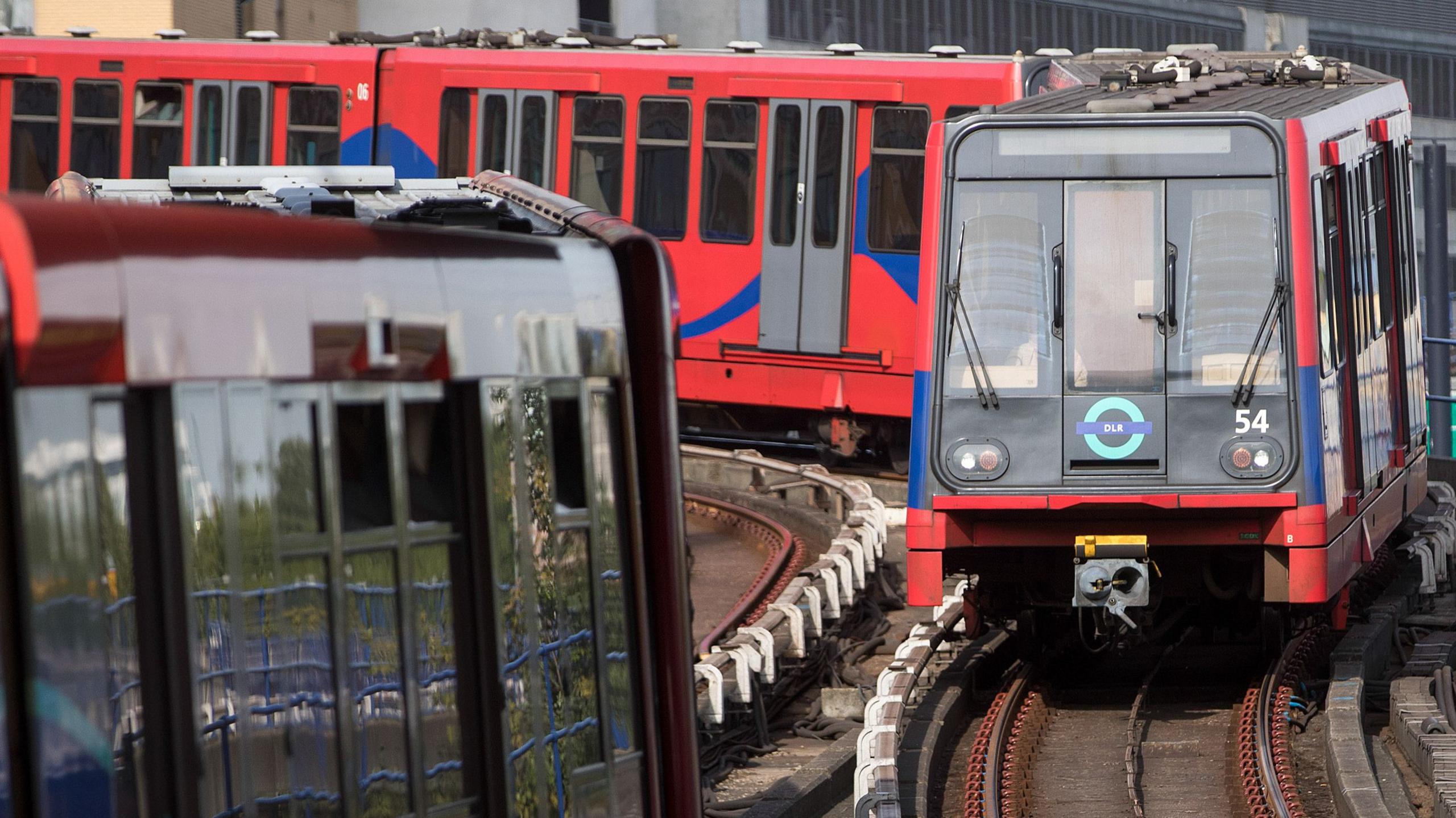 Red DLR train on tracks