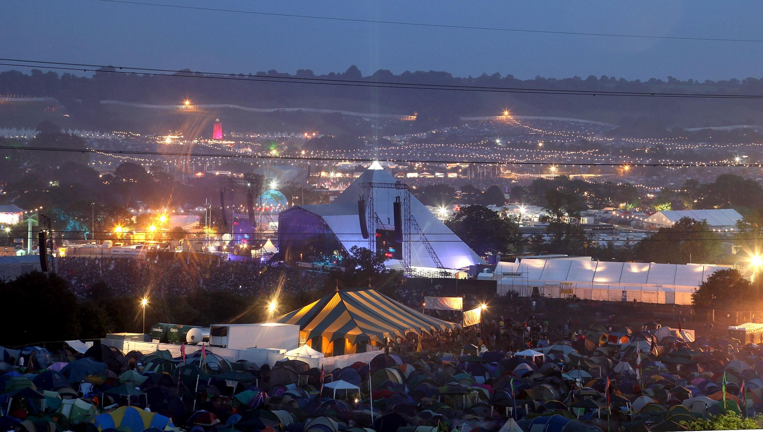 A hilltop view of Glastonbury's Pyramid Stage and surrounding area