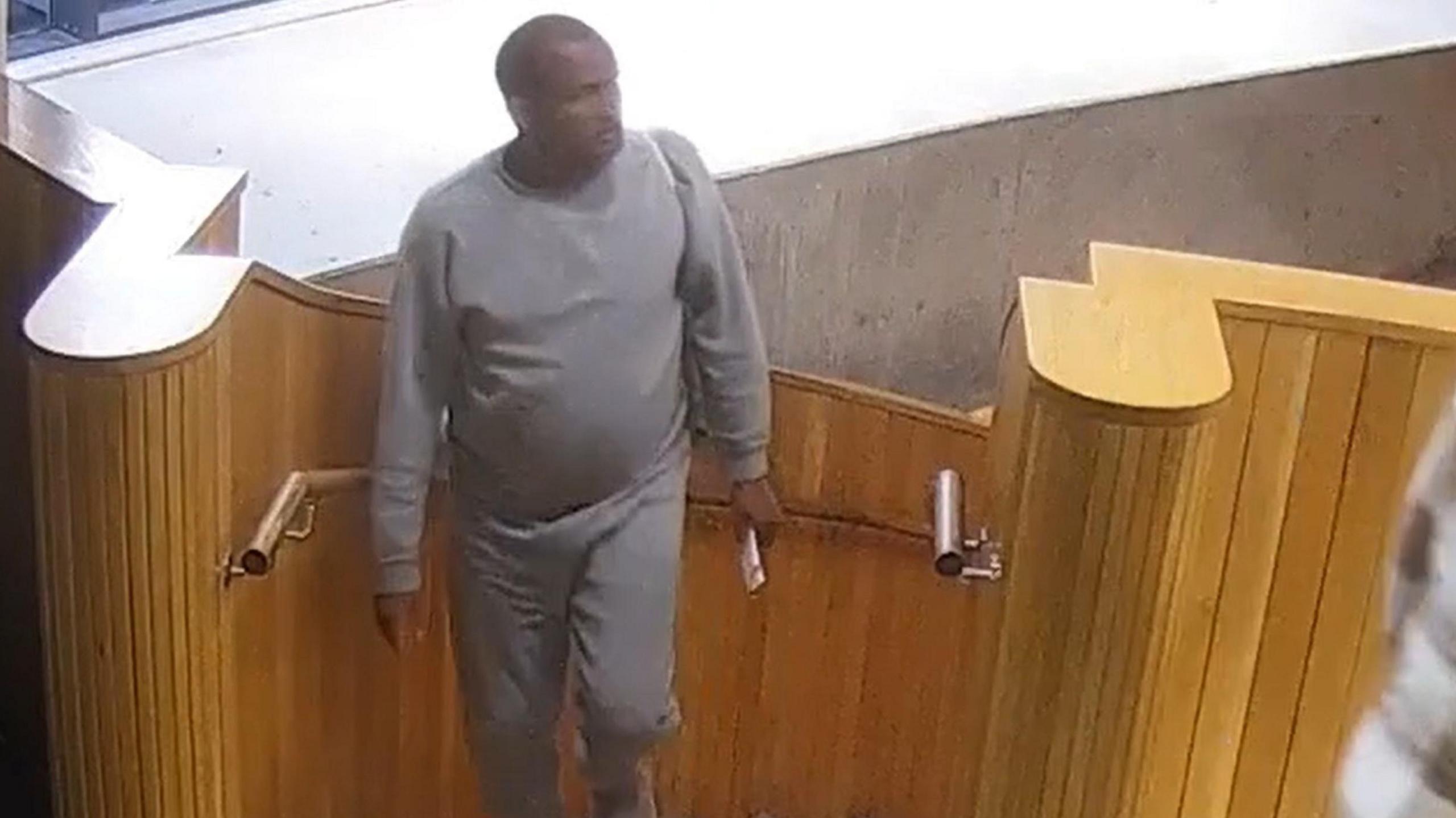 Handout grab from CCTV issued by the Metropolitan Police of Hadush Gerberslasie Kebatu (left) in Dalston on October 24, 2025.