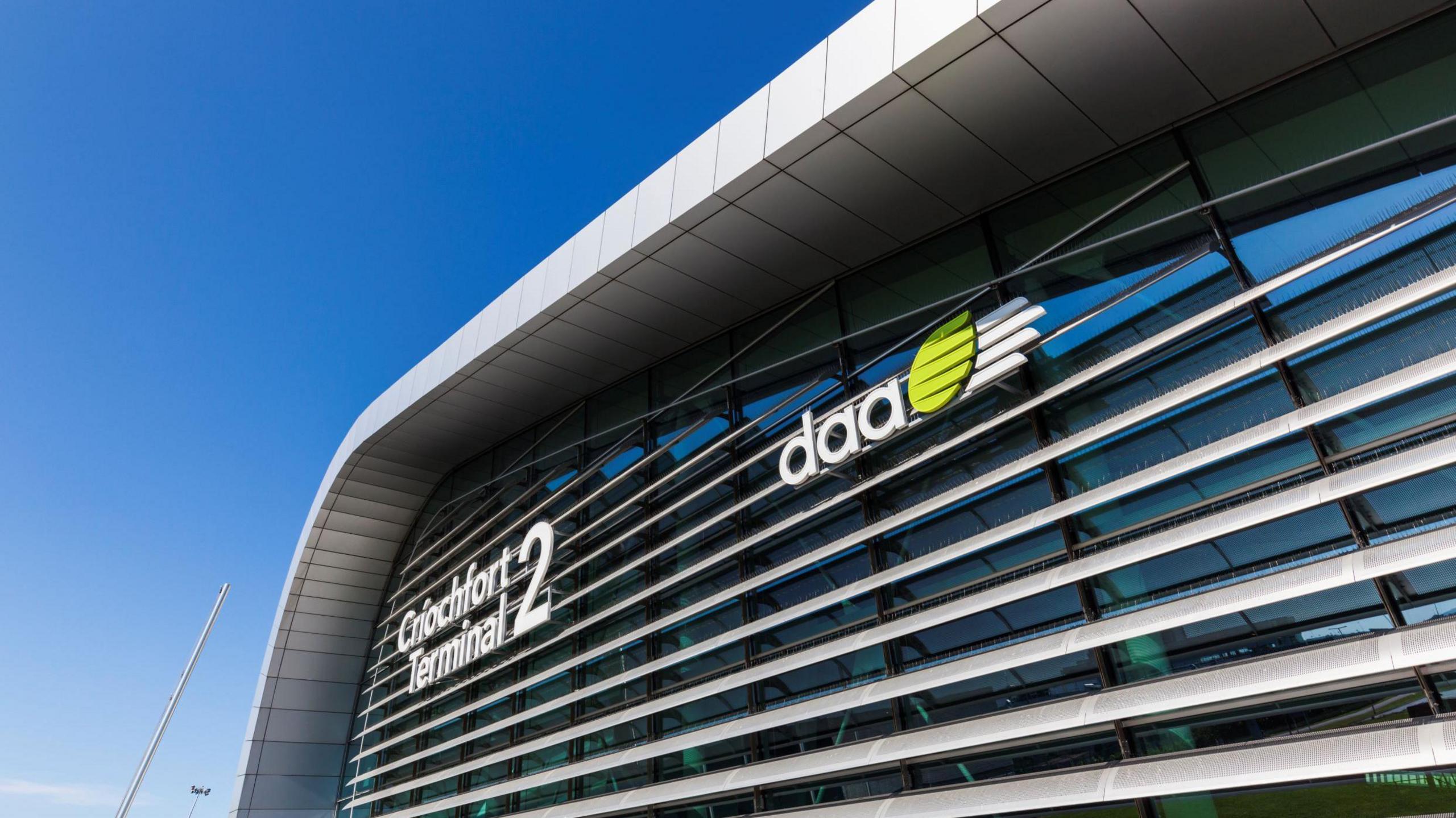 A section of chrome and glass building on which the signs read Criochfort Terminal 2/ daa