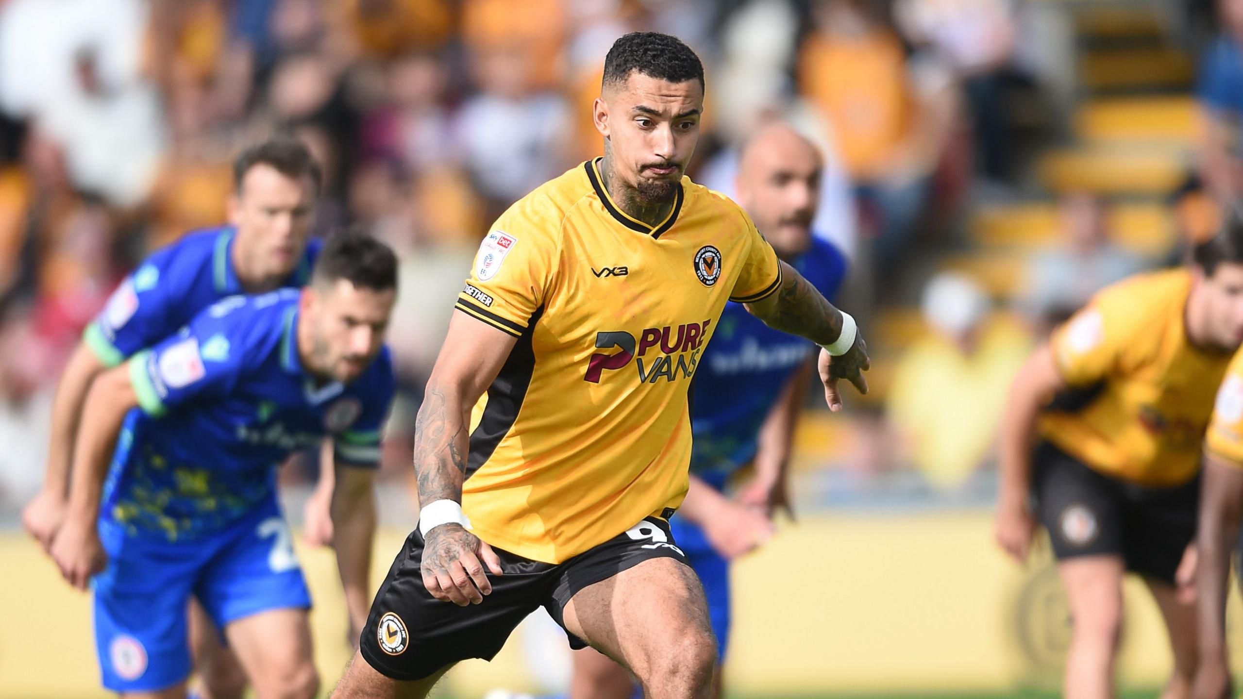 Newport County striker Courtney Baker-Richardson strikes a penalty