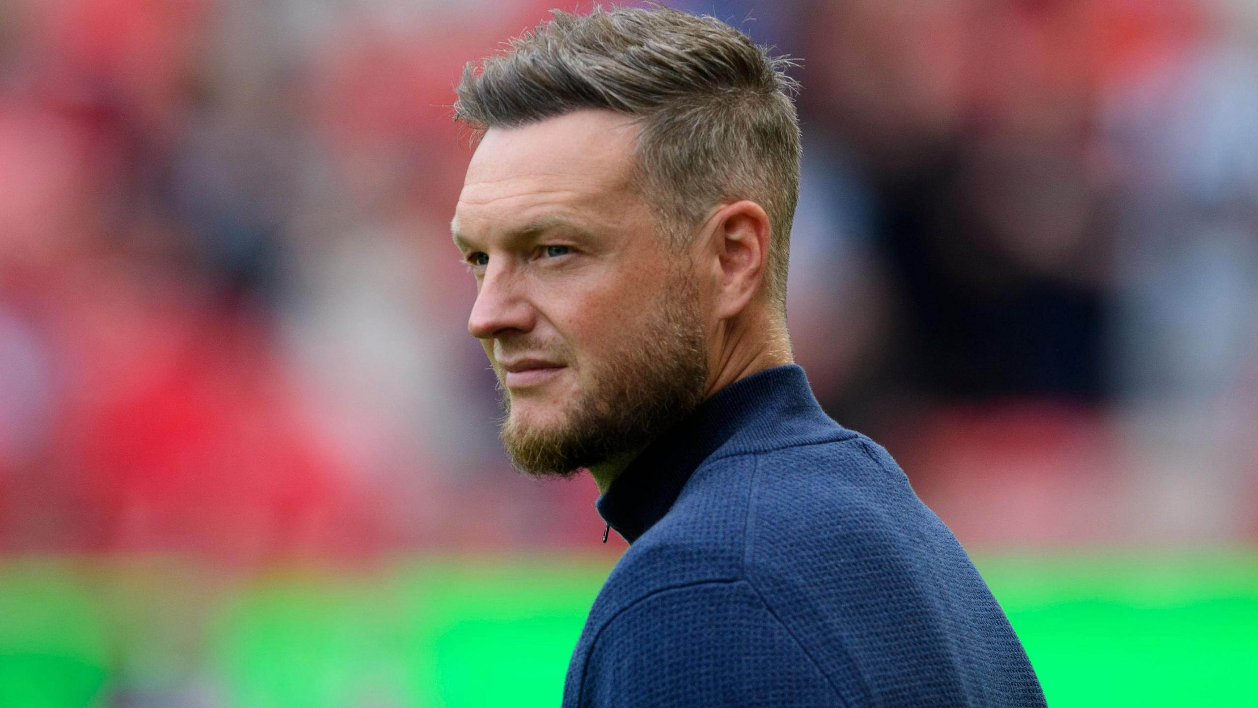 Kim Hellberg, wearing a navy blue sweater during the game against Lincoln City