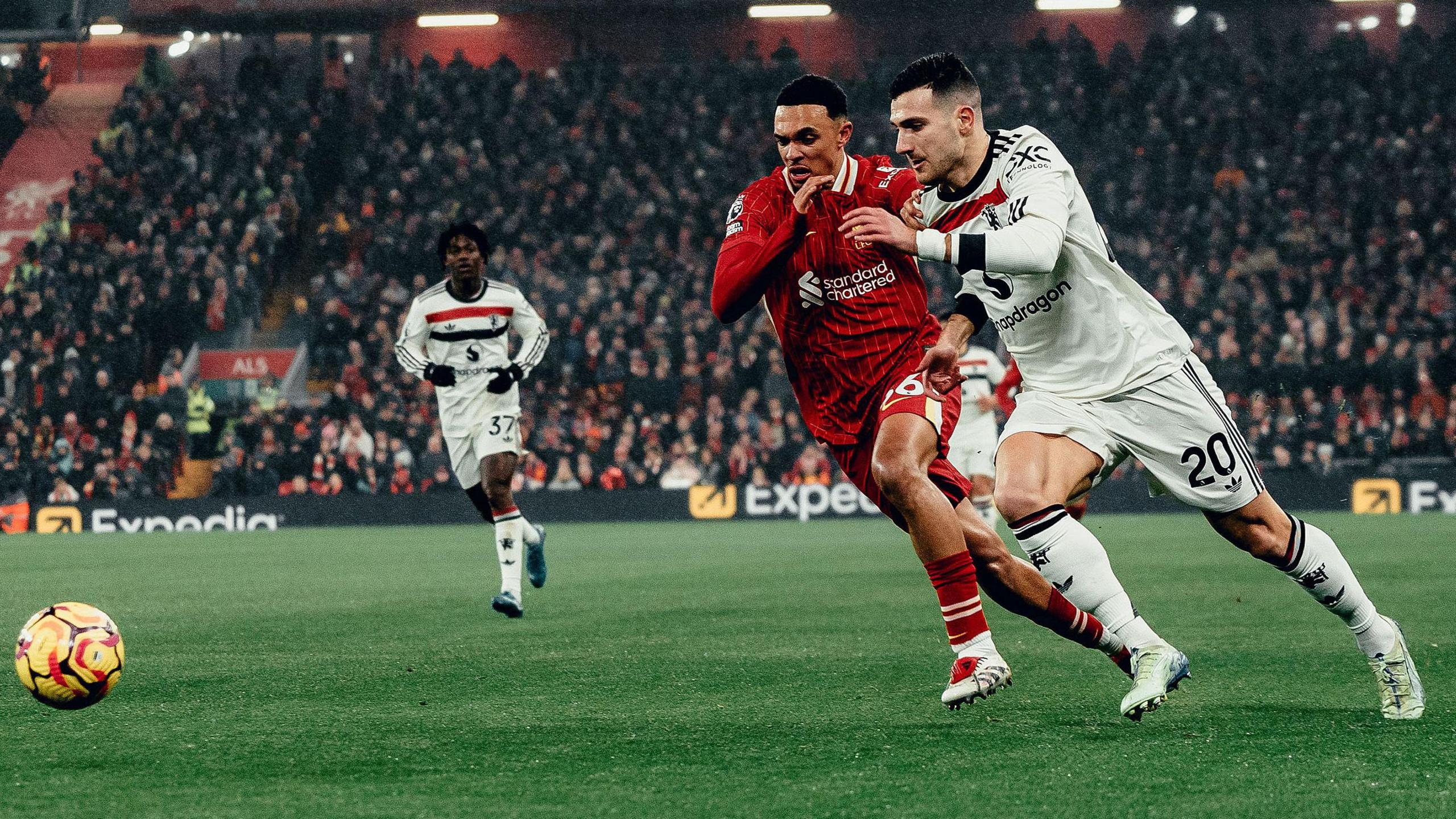 Liverpool's Trent Alexander-Arnold defends against Manchester United's Diogo Dalot at Anfield